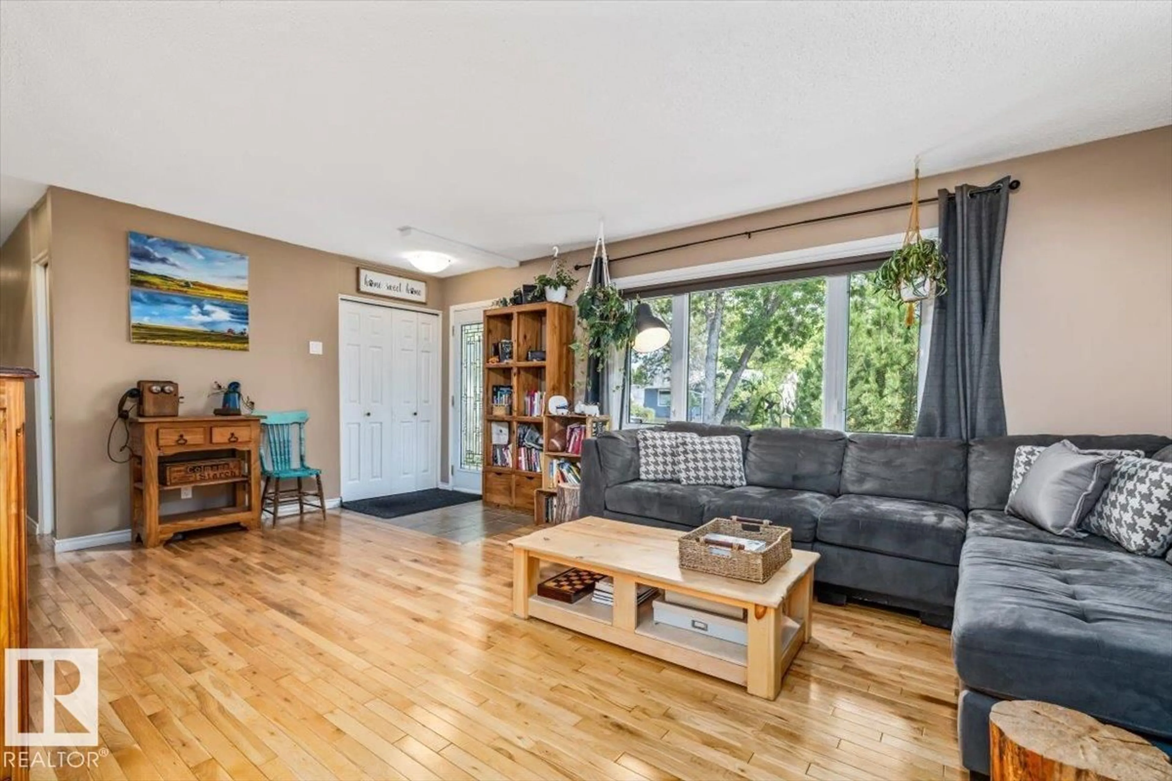 Living room with furniture, wood/laminate floor for 9212 93 ST, Fort Saskatchewan Alberta T0M2C0