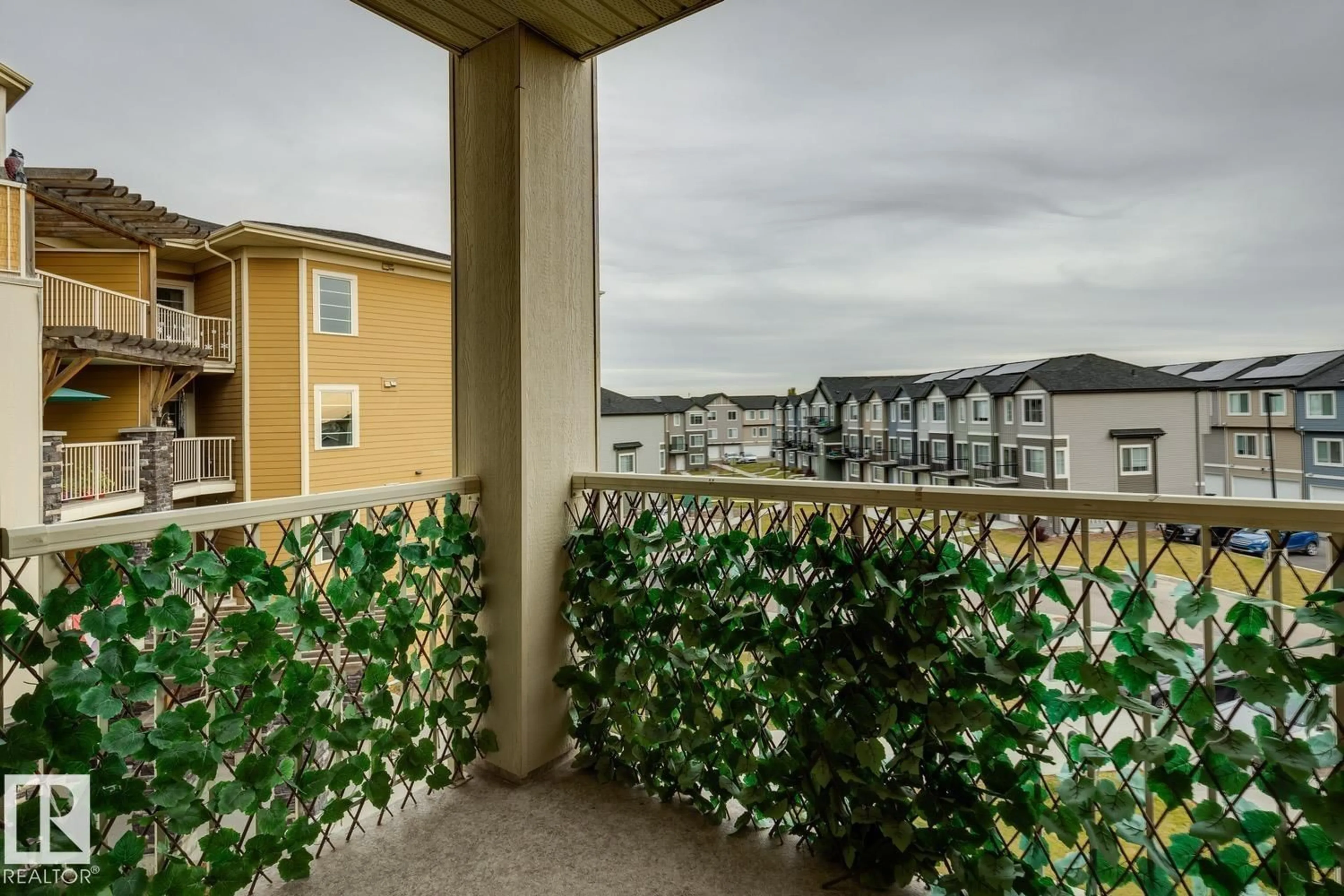 Balcony in the apartment, city buildings view from balcony for #312 - 3670 139 AV NW, Edmonton Alberta T5Y3N5