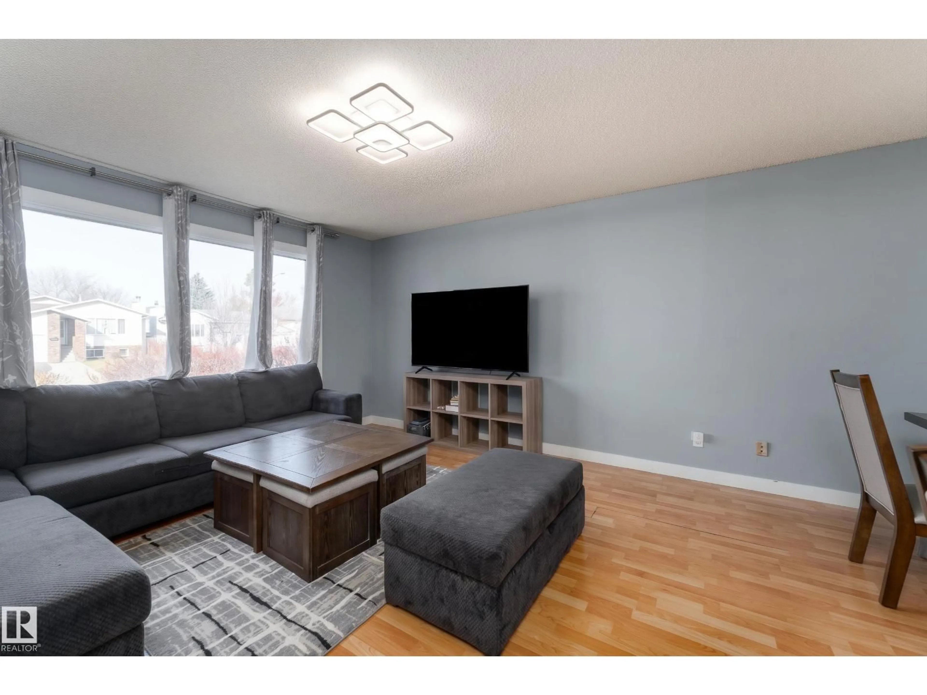 Living room with furniture, wood/laminate floor for 4535 30 AV, Edmonton Alberta T6L4S6