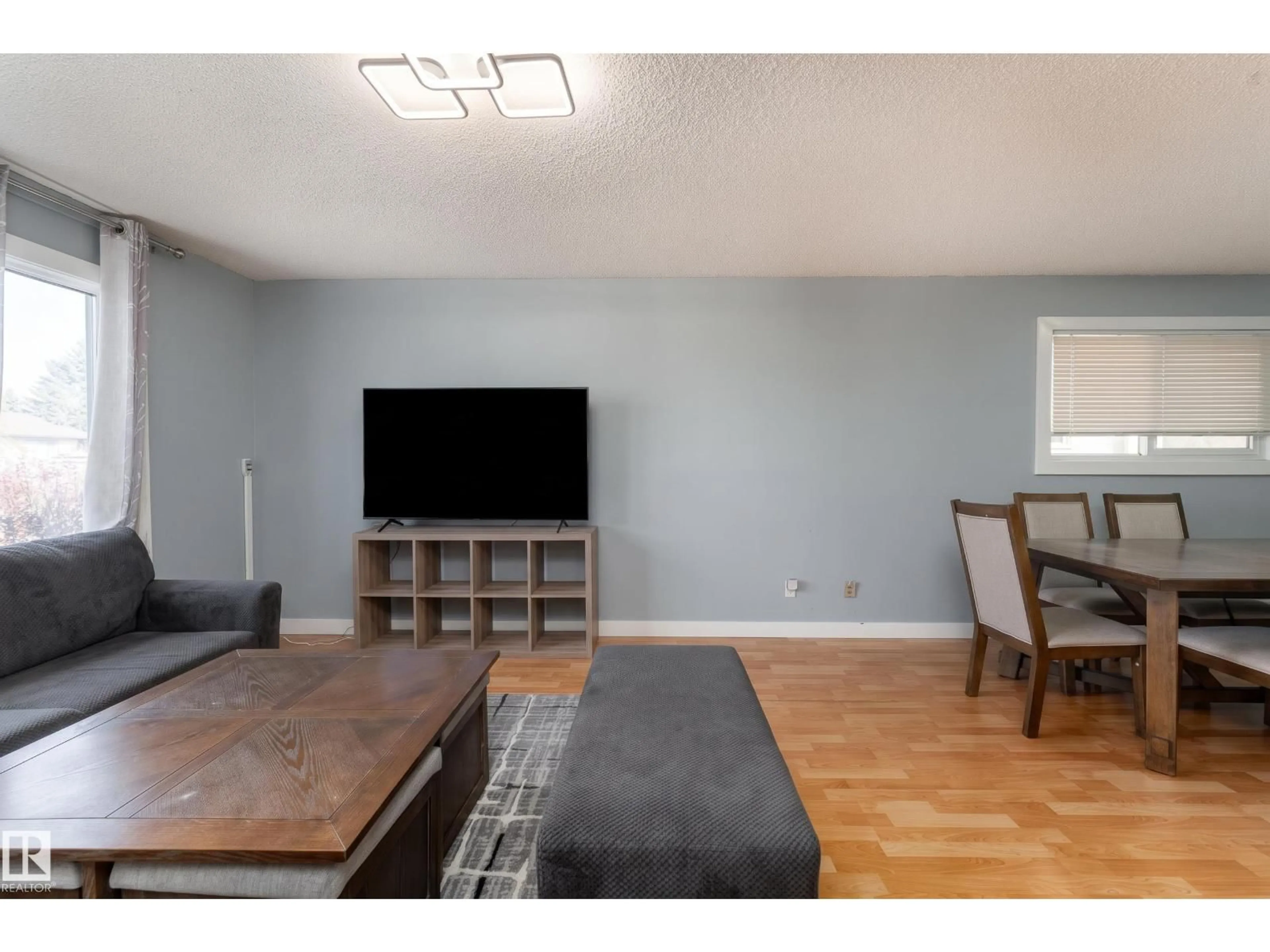Living room with furniture, wood/laminate floor for 4535 30 AV, Edmonton Alberta T6L4S6