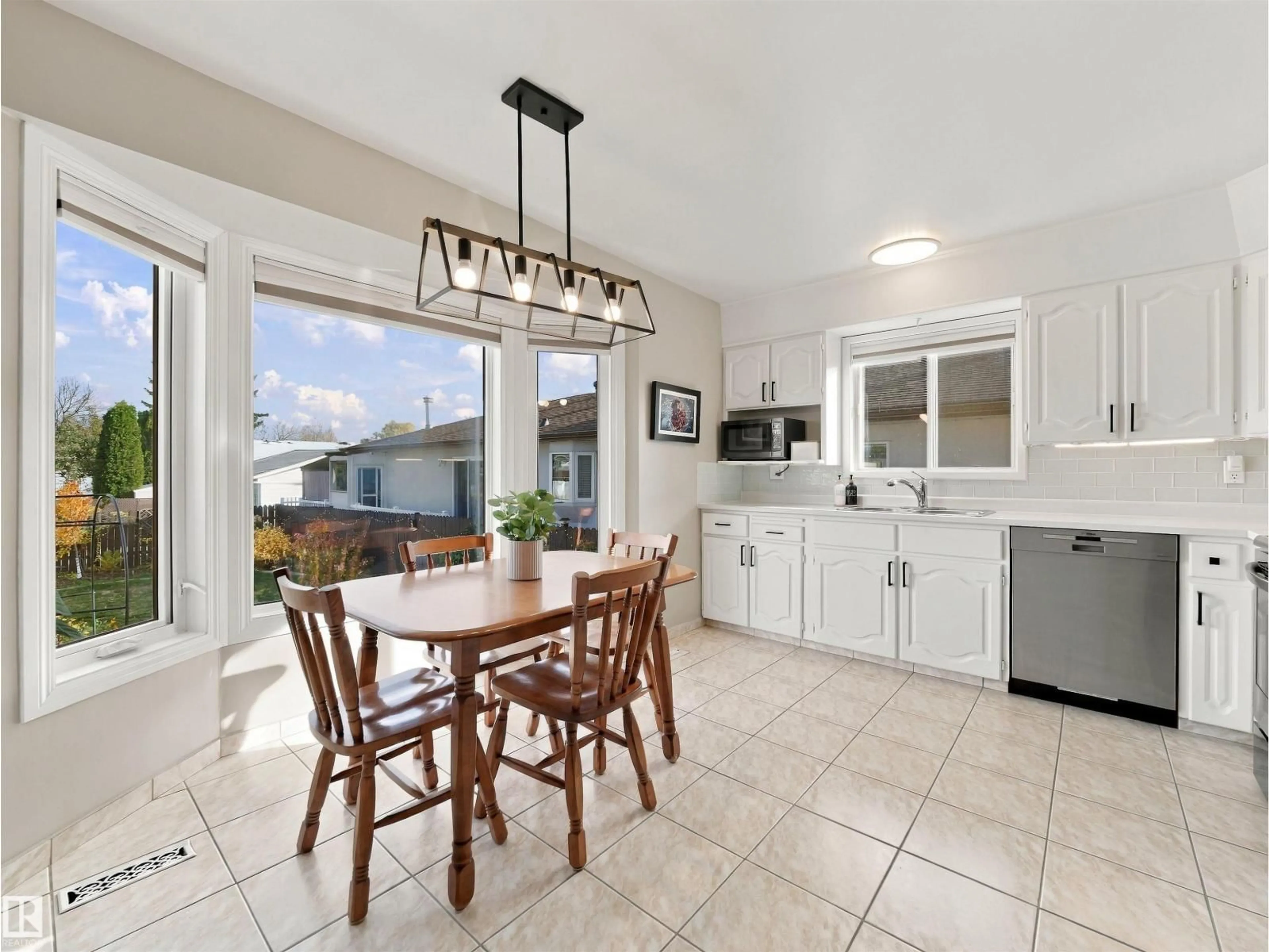 Open concept kitchen, ceramic/tile floor for 16107 101 ST, Edmonton Alberta T5X5A3