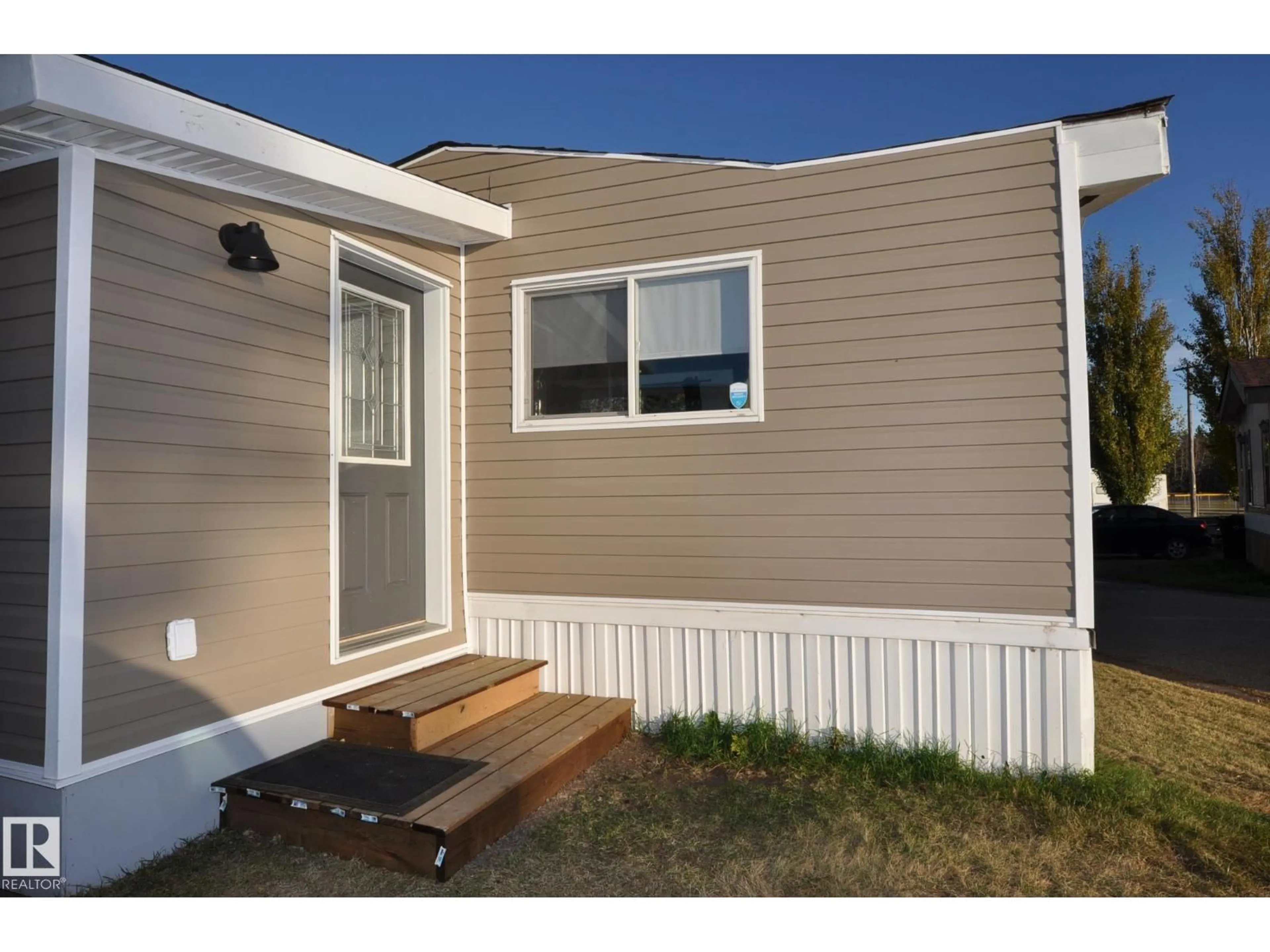 Home with vinyl exterior material, street for #26 - 10410 101 A ST, Morinville Alberta T8R1B1