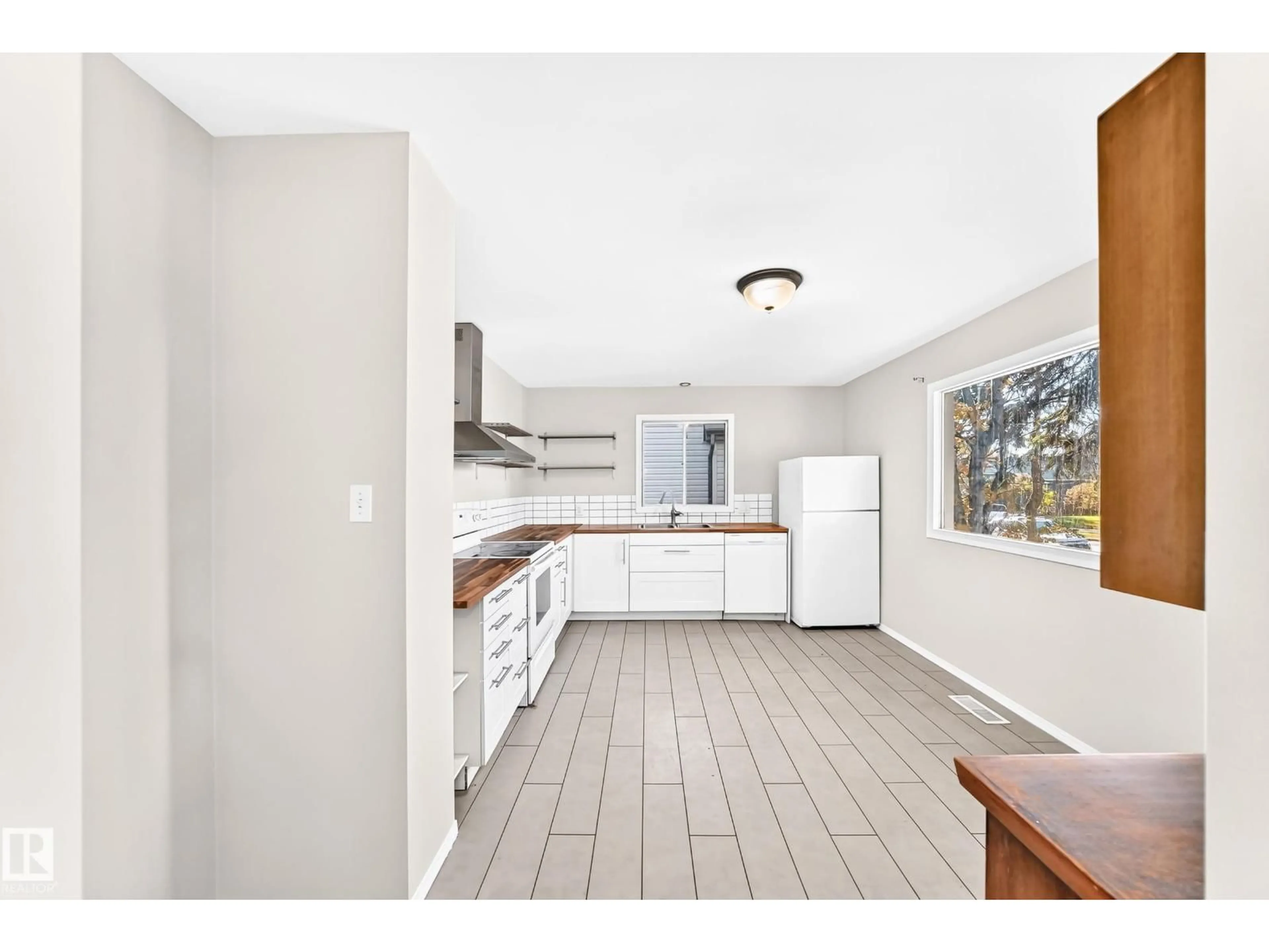 Open concept kitchen, ceramic/tile floor for 12217 88 ST, Edmonton Alberta T5B3S7