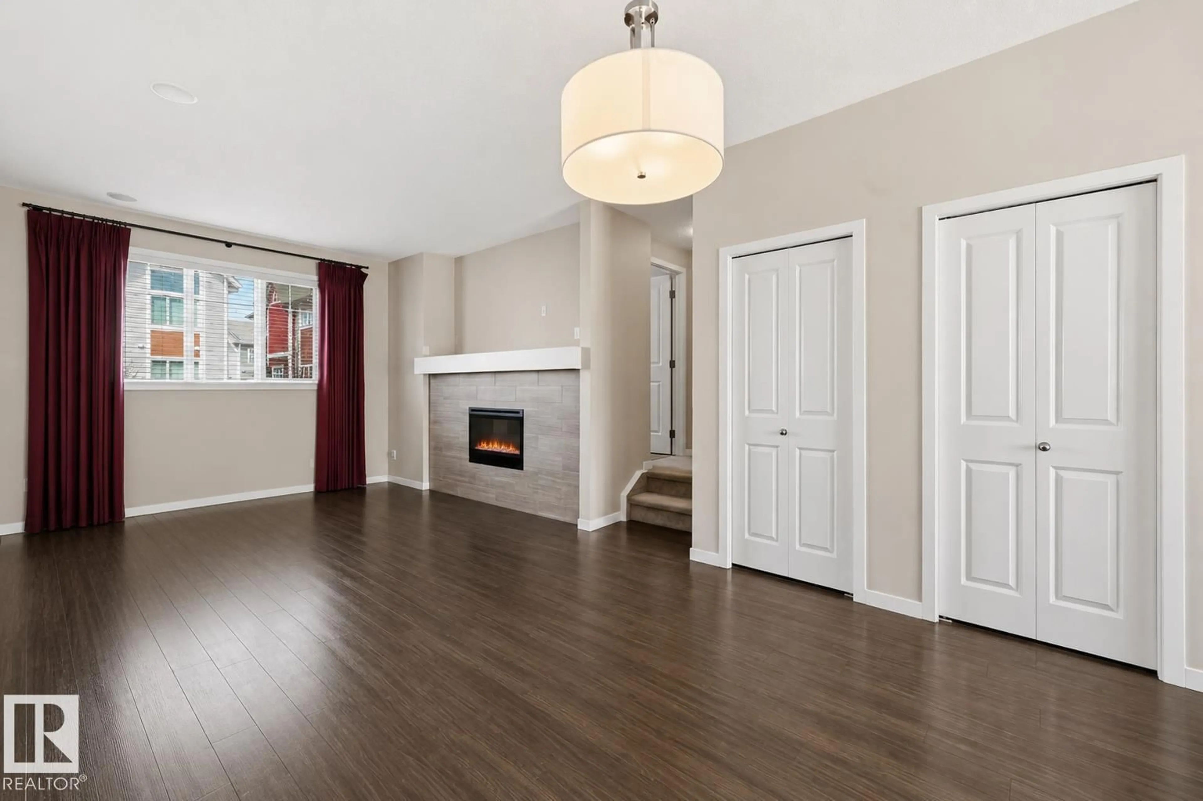 Living room with furniture, wood/laminate floor for #4 - 320 SECORD BV, Edmonton Alberta T5T7E8