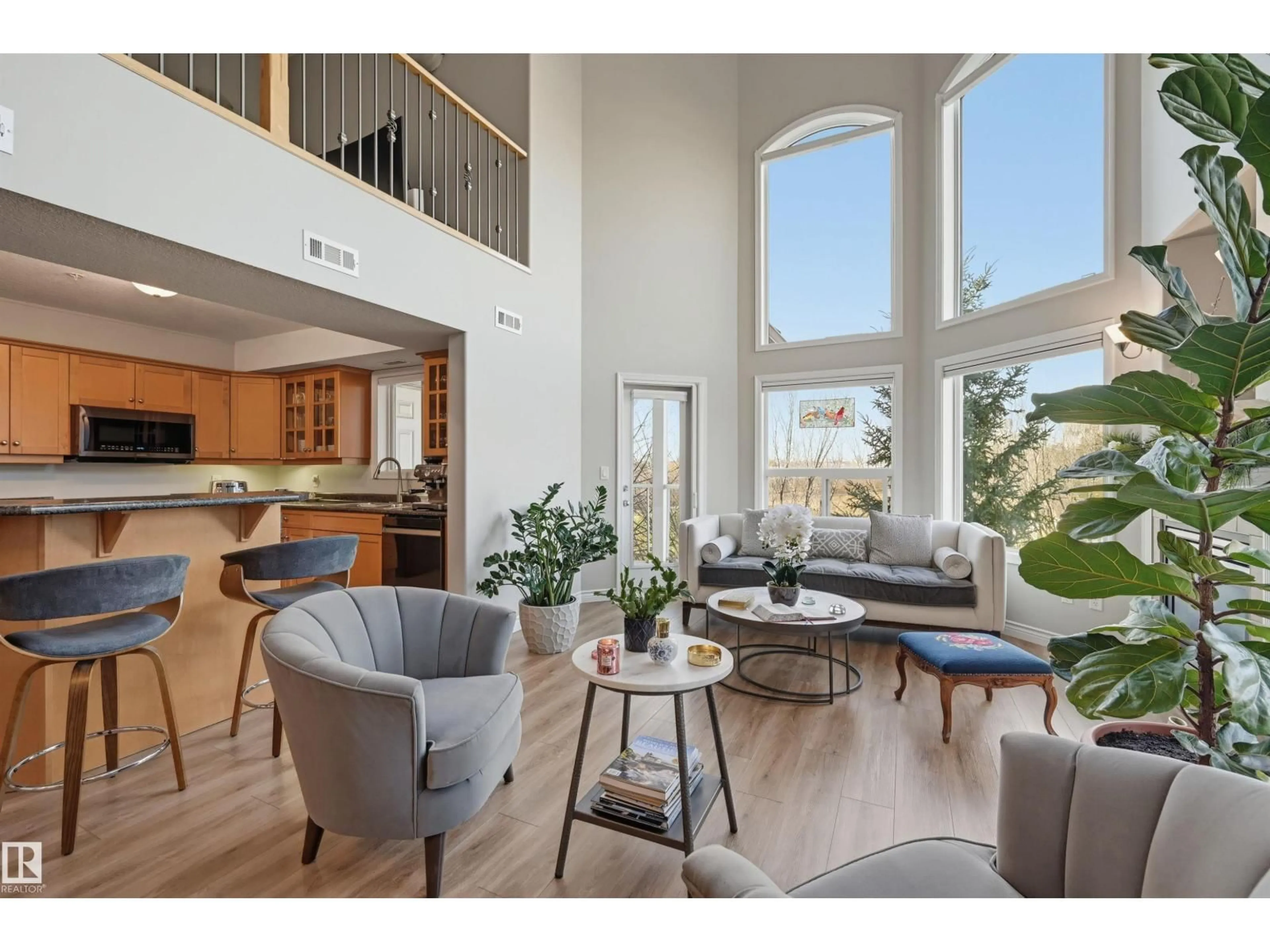 Living room with furniture, wood/laminate floor for 427 - 9008 99 AV, Edmonton Alberta T5H4M6