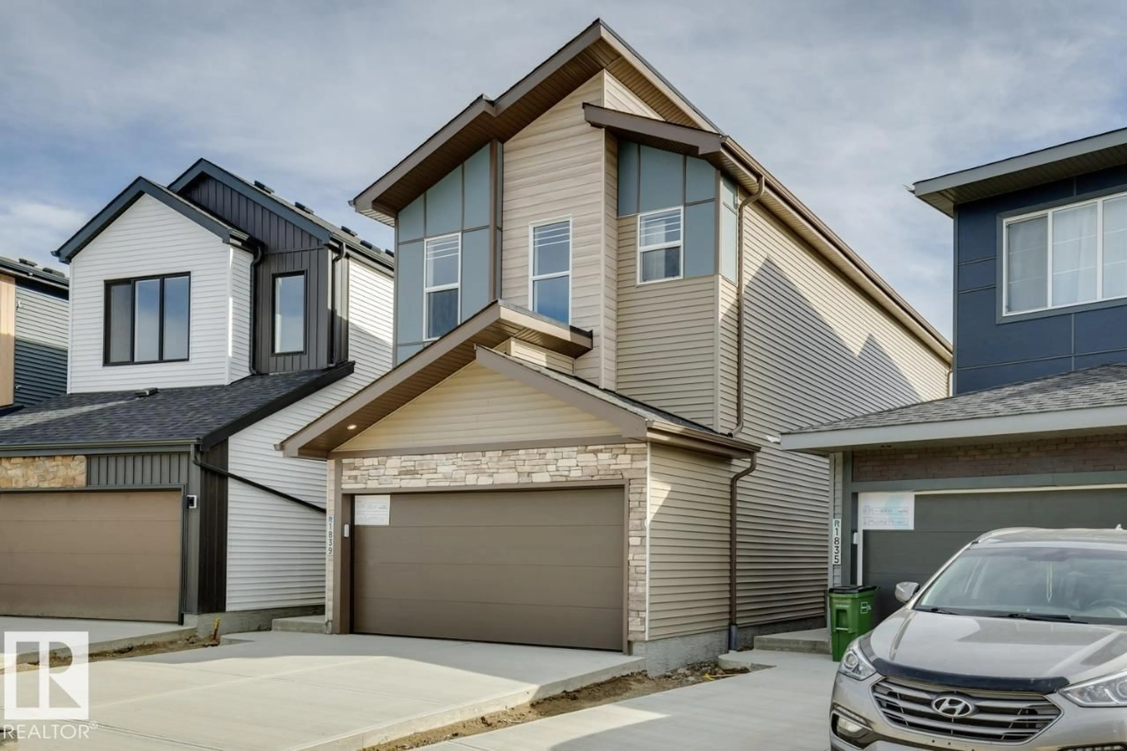 Home with vinyl exterior material, street for NW - 1839 188 ST, Edmonton Alberta T6T2M9