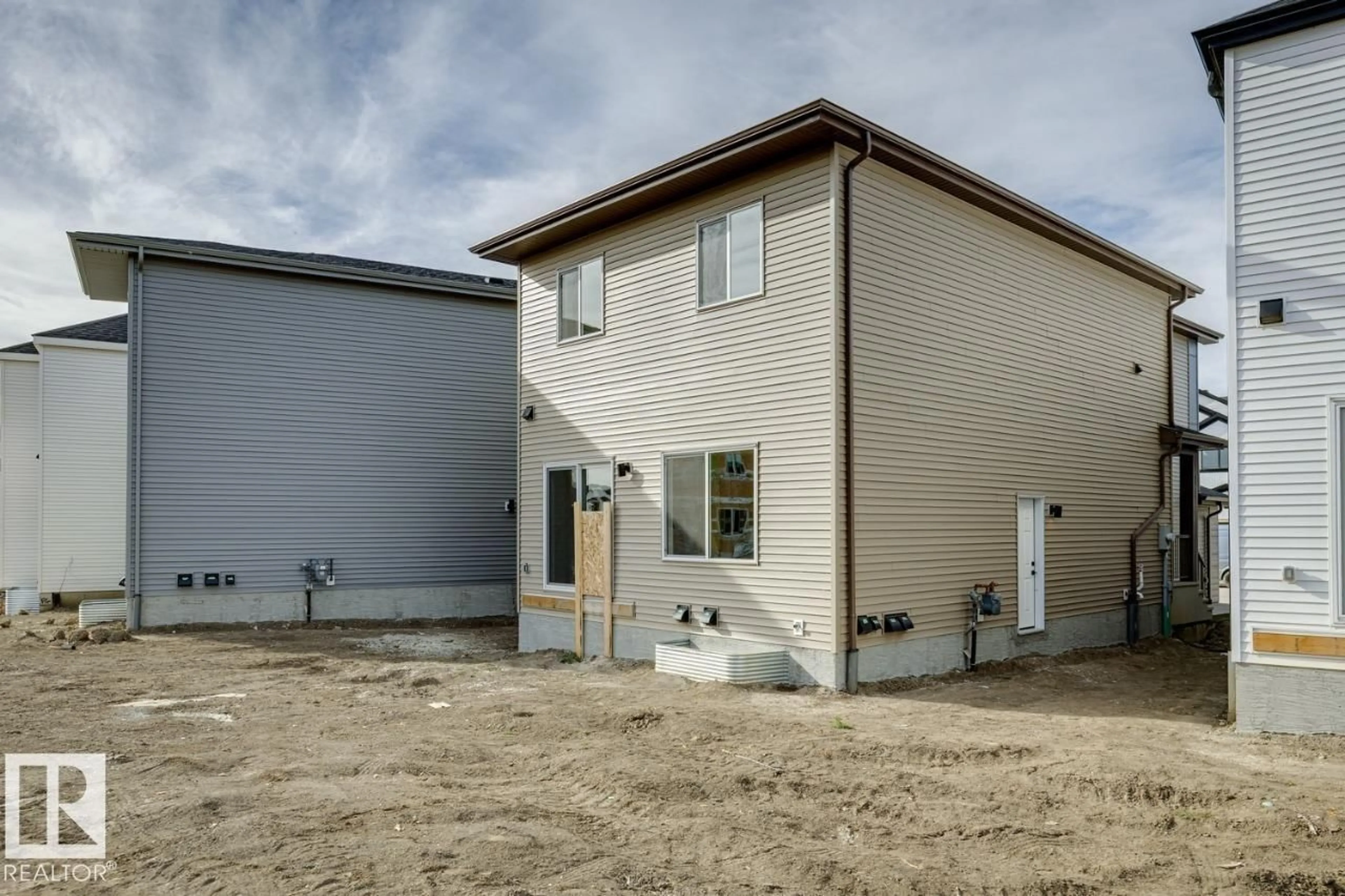 Home with vinyl exterior material, street for NW - 1839 188 ST, Edmonton Alberta T6T2M9