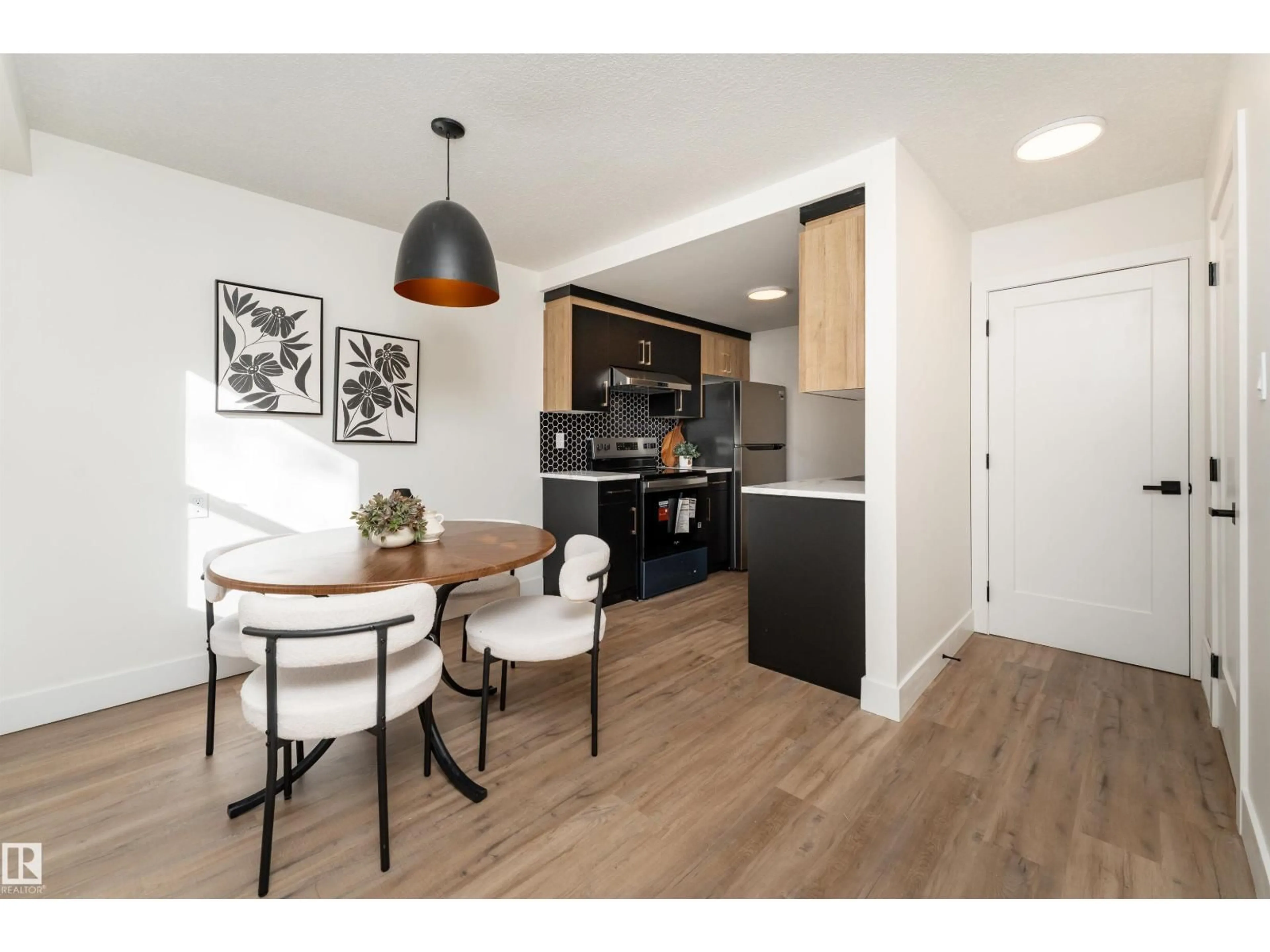 Open concept kitchen, wood/laminate floor for 193a HOMESTEAD CR, Edmonton Alberta T5A2Y2