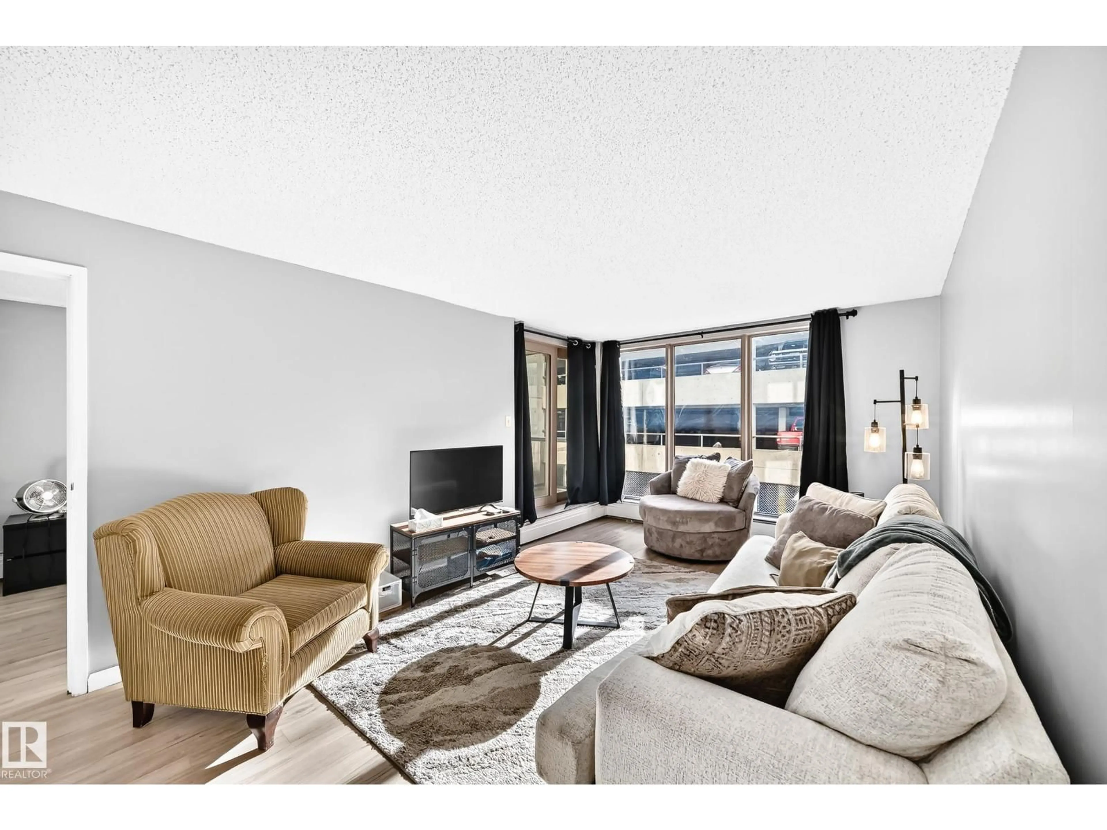 Living room with furniture, unknown for #200 - 10149 SASKATCHEWAN DR NW, Edmonton Alberta T6E6B6