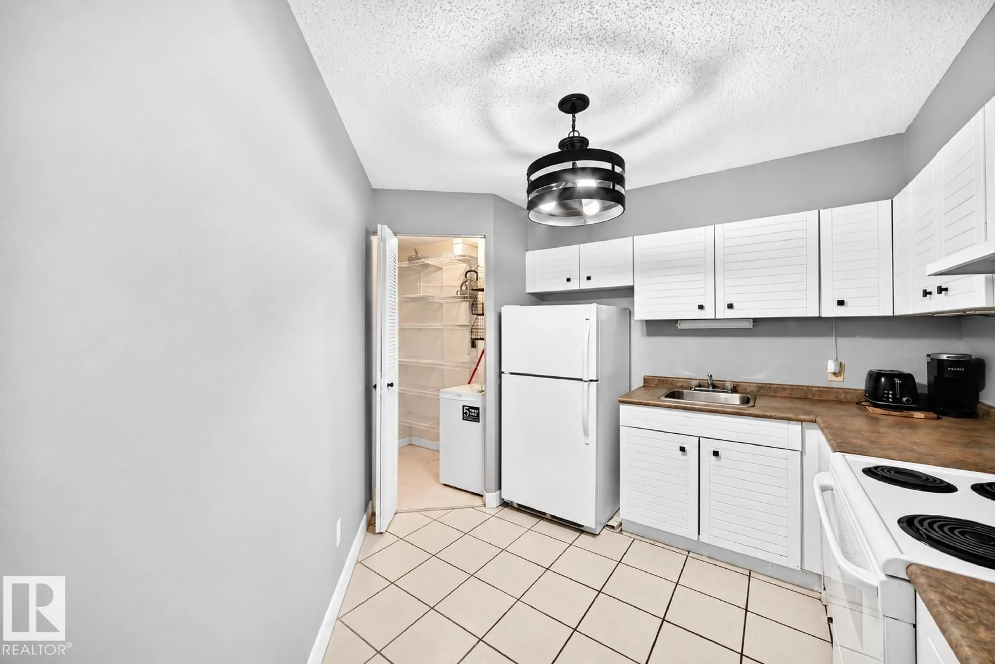 Standard kitchen, ceramic/tile floor for #200 - 10149 SASKATCHEWAN DR NW, Edmonton Alberta T6E6B6