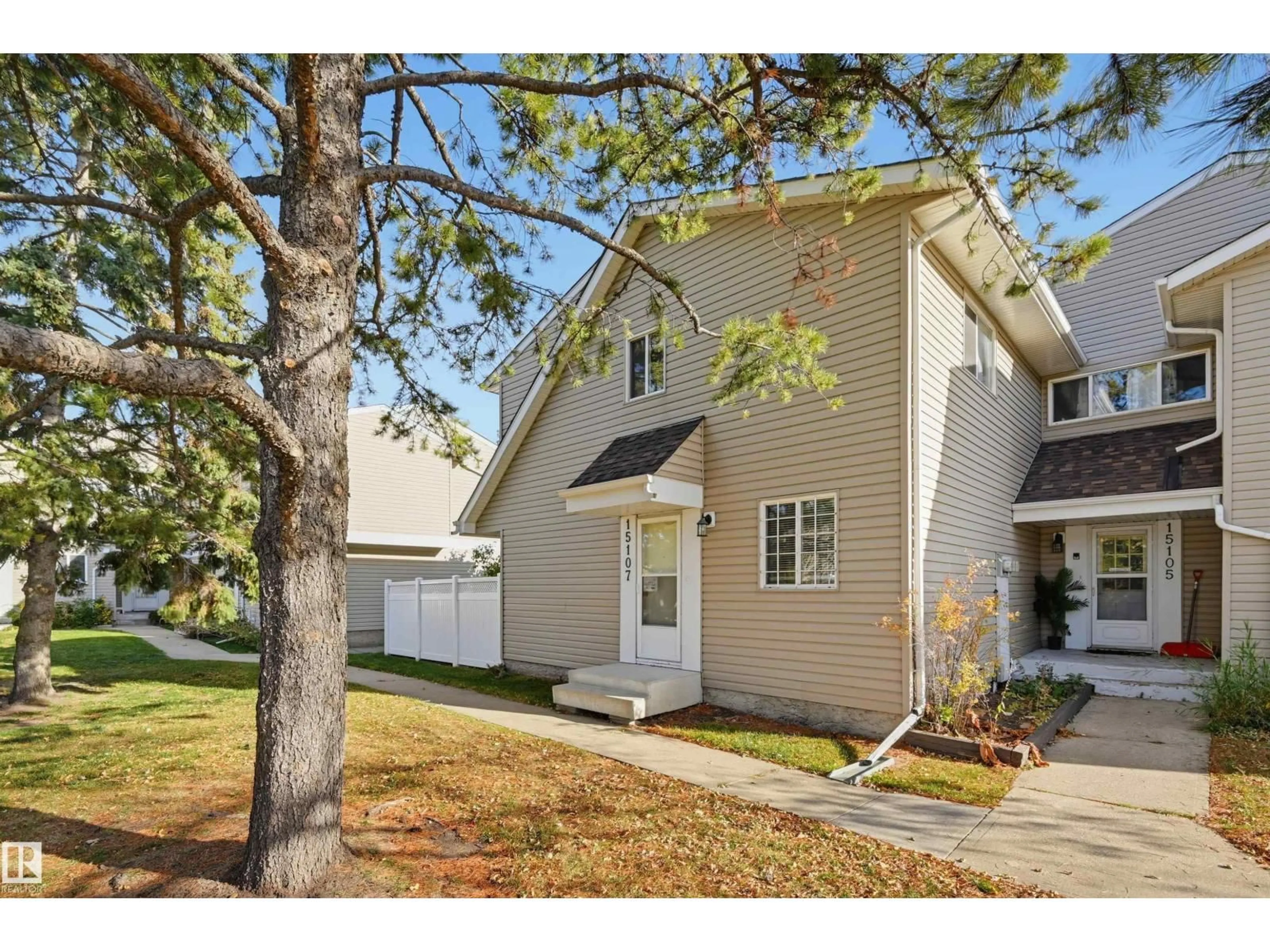 Home with vinyl exterior material, street for 15107 54 ST, Edmonton Alberta T5A3N9