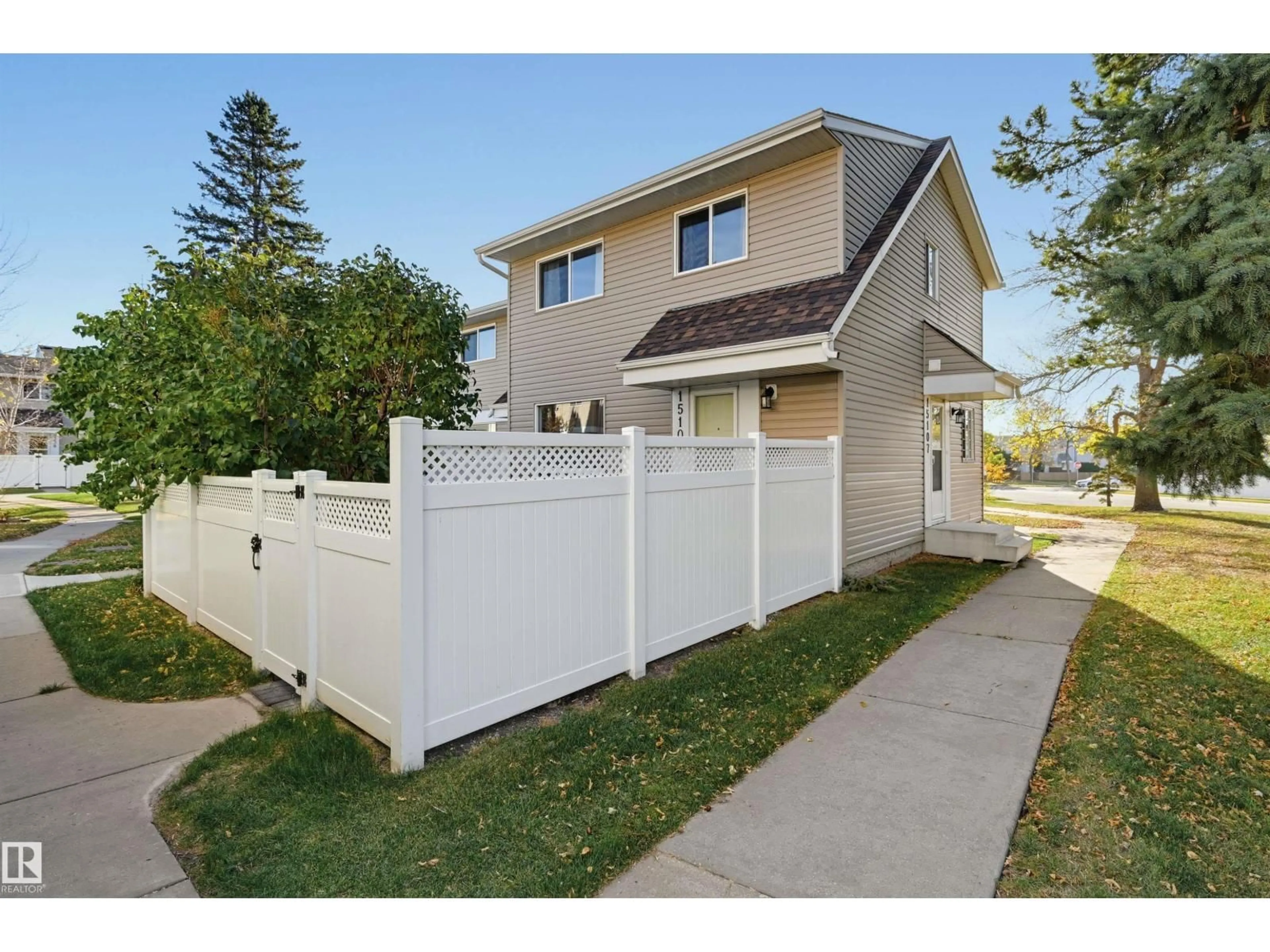 Home with vinyl exterior material, street for 15107 54 ST, Edmonton Alberta T5A3N9