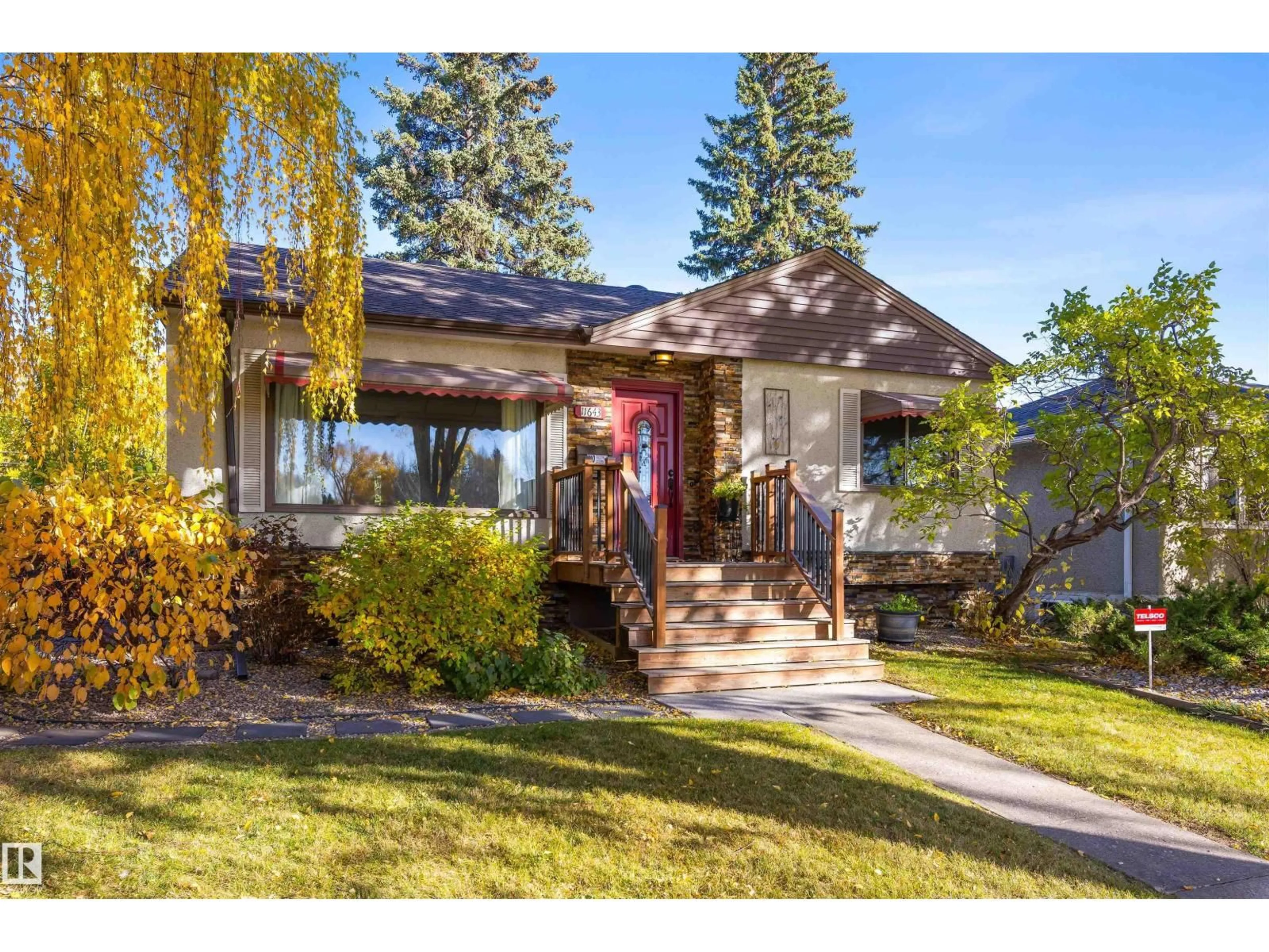 Home with vinyl exterior material, street for NW - 11643 137 ST, Edmonton Alberta T5M1N8