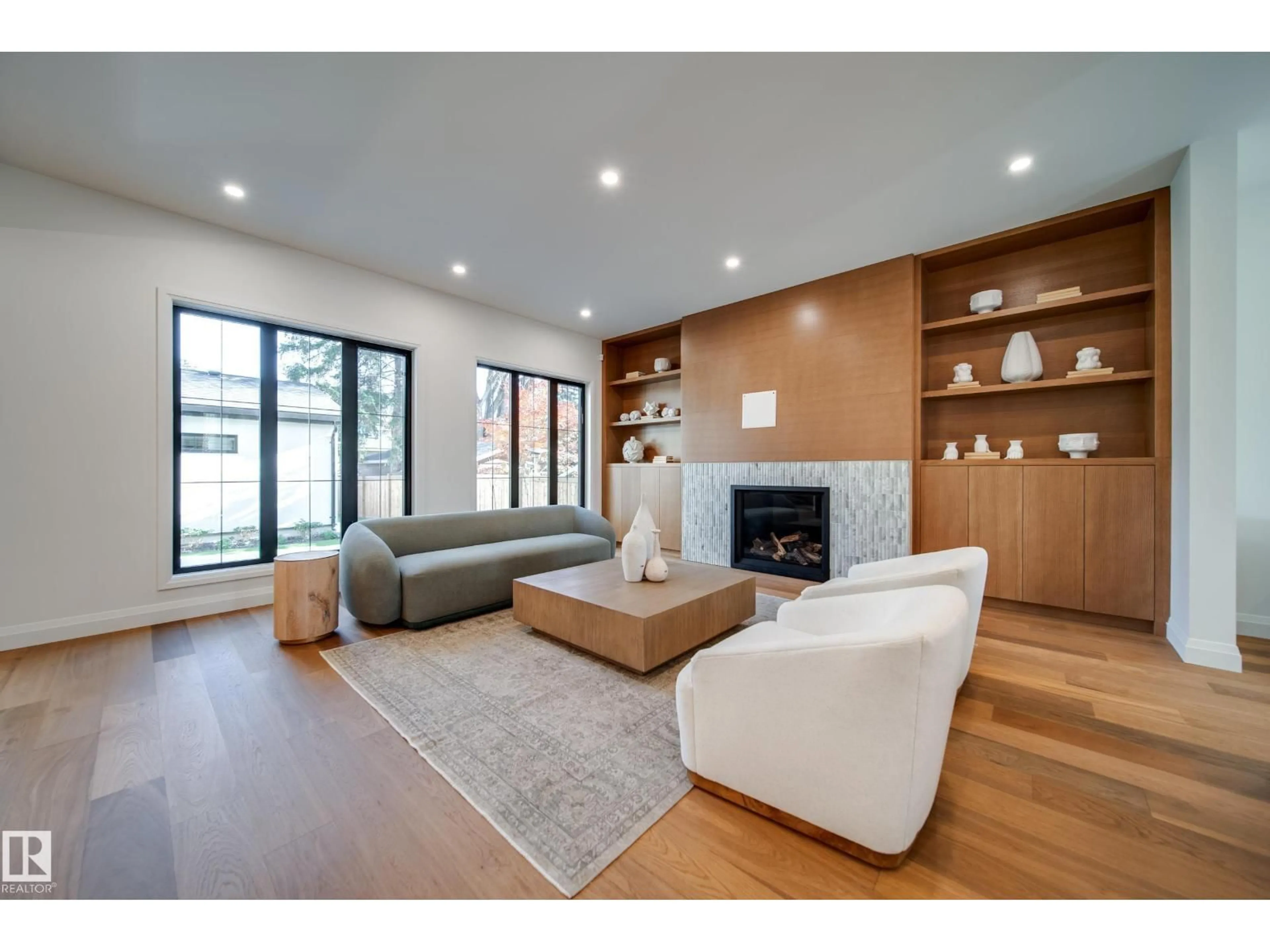 Living room with furniture, wood/laminate floor for NW - 10223 130 ST, Edmonton Alberta T5N1X4