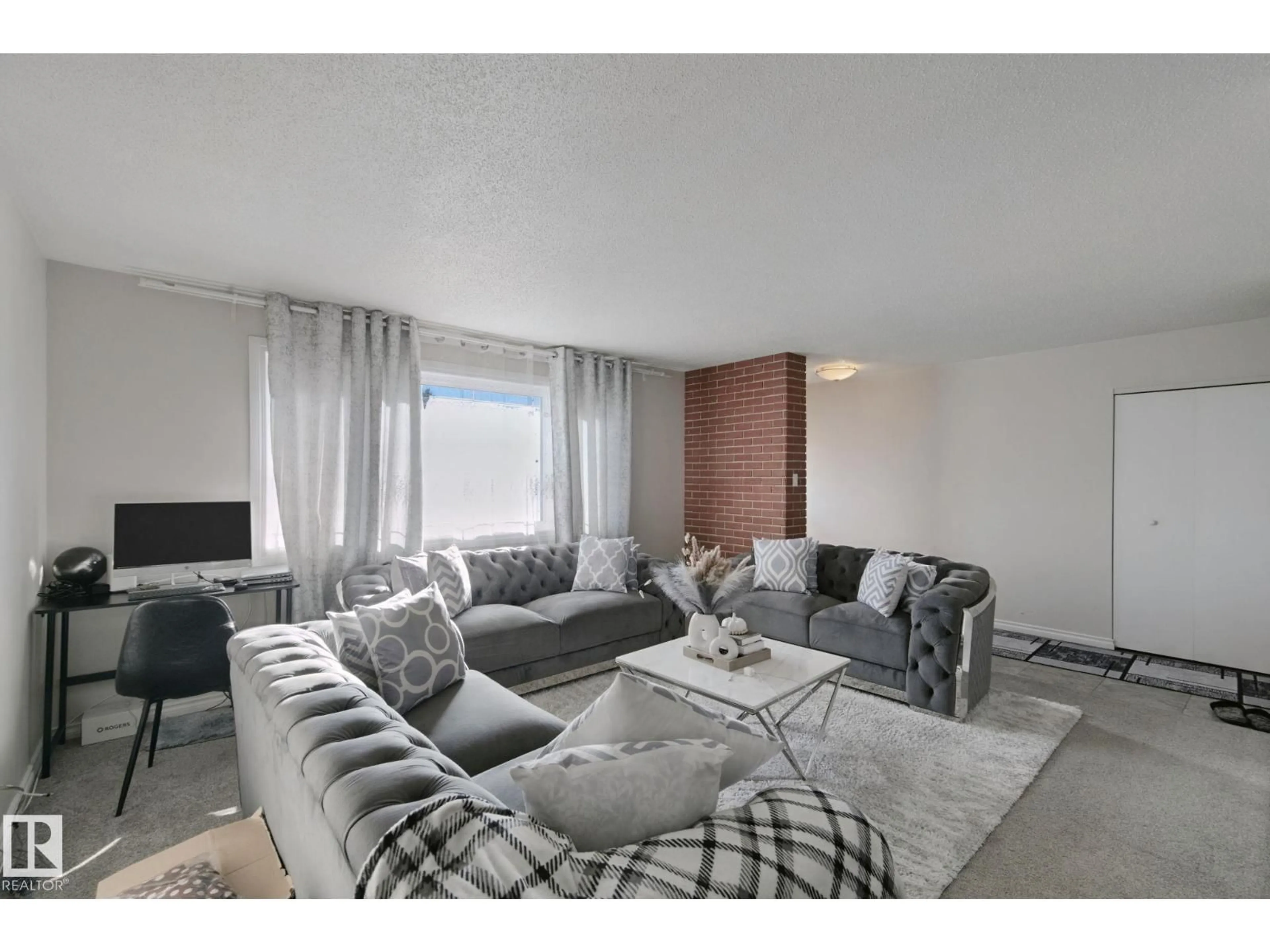 Living room with furniture, unknown for 7332 149A AV, Edmonton Alberta T5C2W4