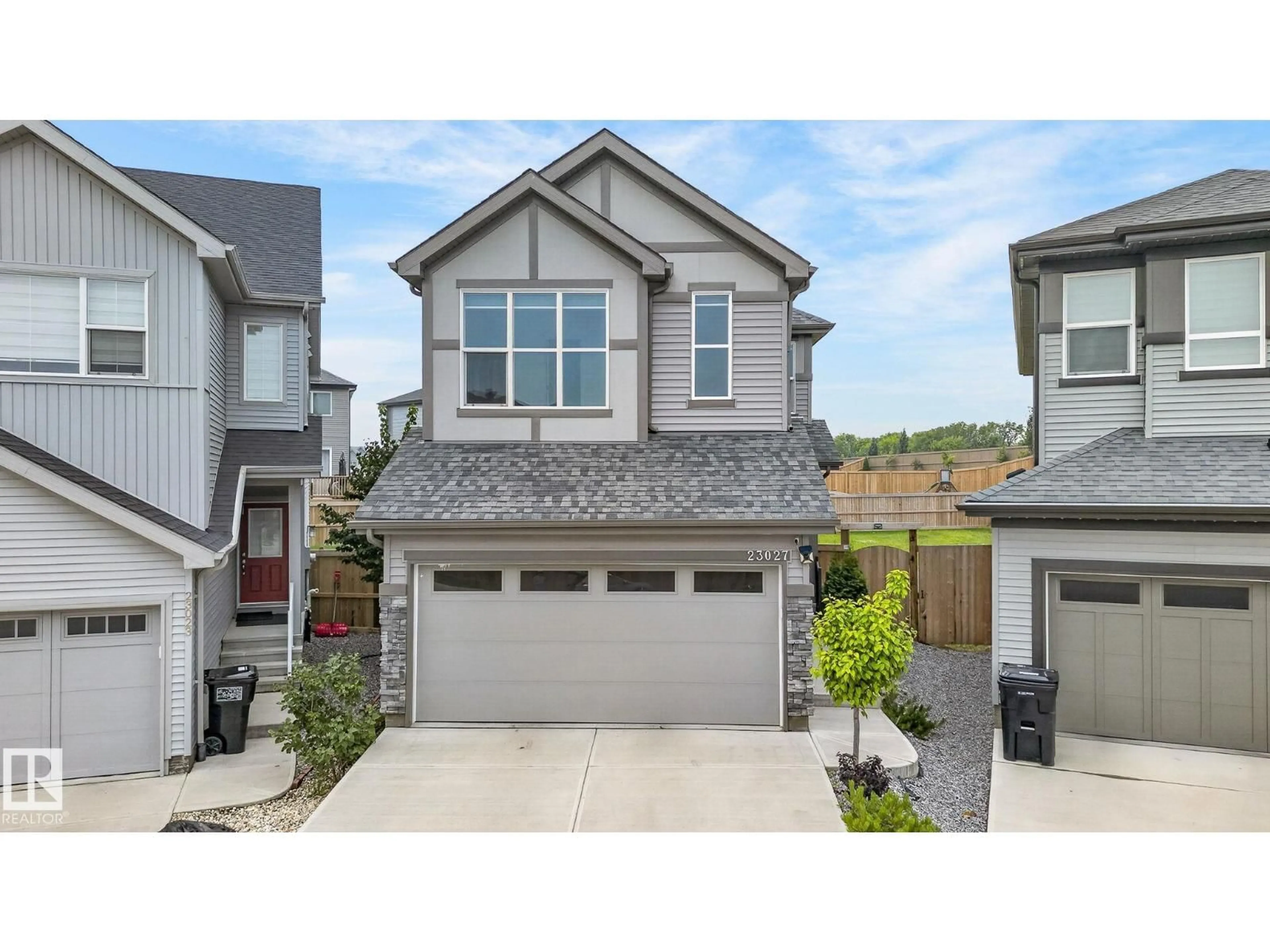 Home with vinyl exterior material, street for 23027 96 AV, Edmonton Alberta T5T7R4