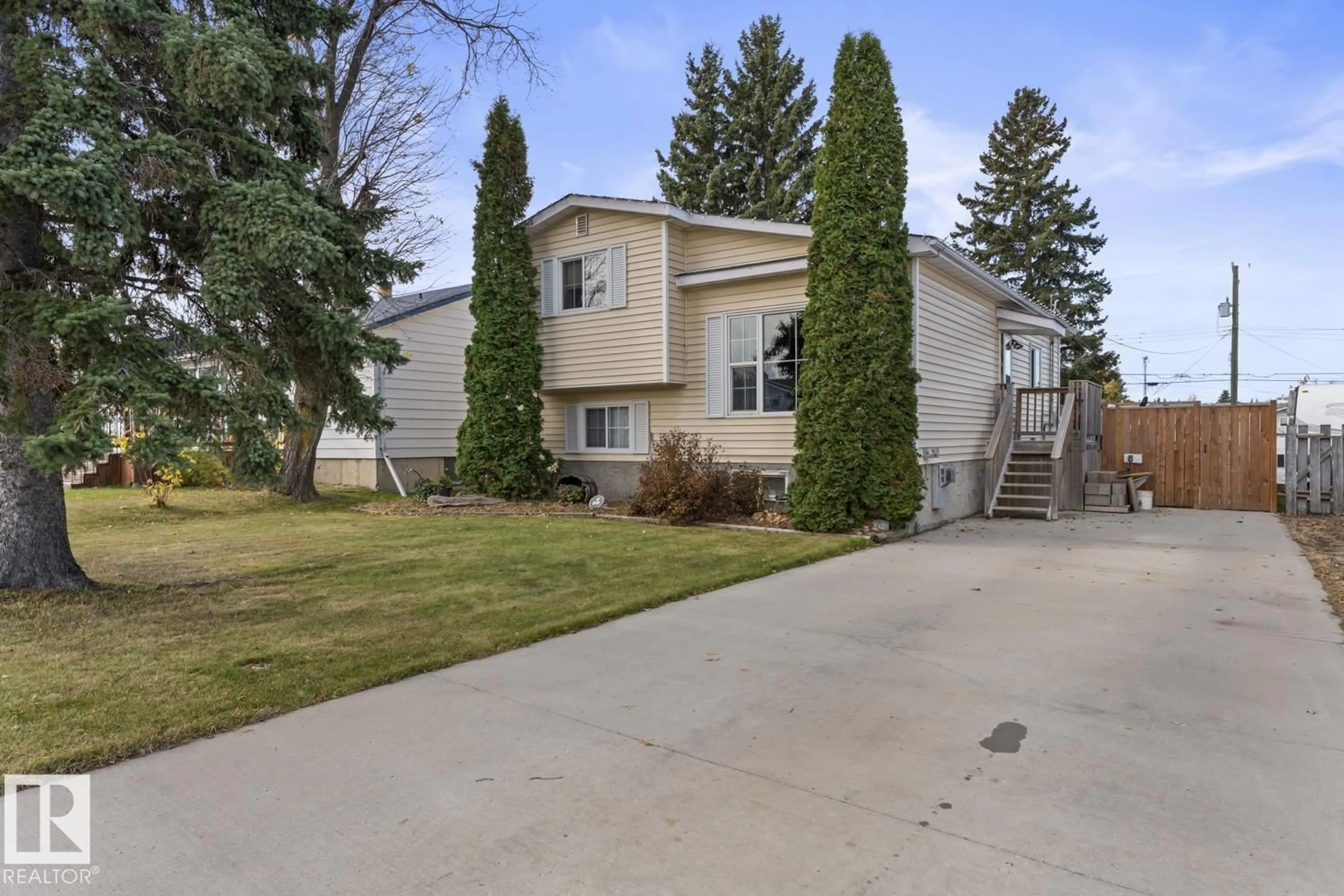 Home with vinyl exterior material, street for 1211 10 ST, Cold Lake Alberta T9M1J6
