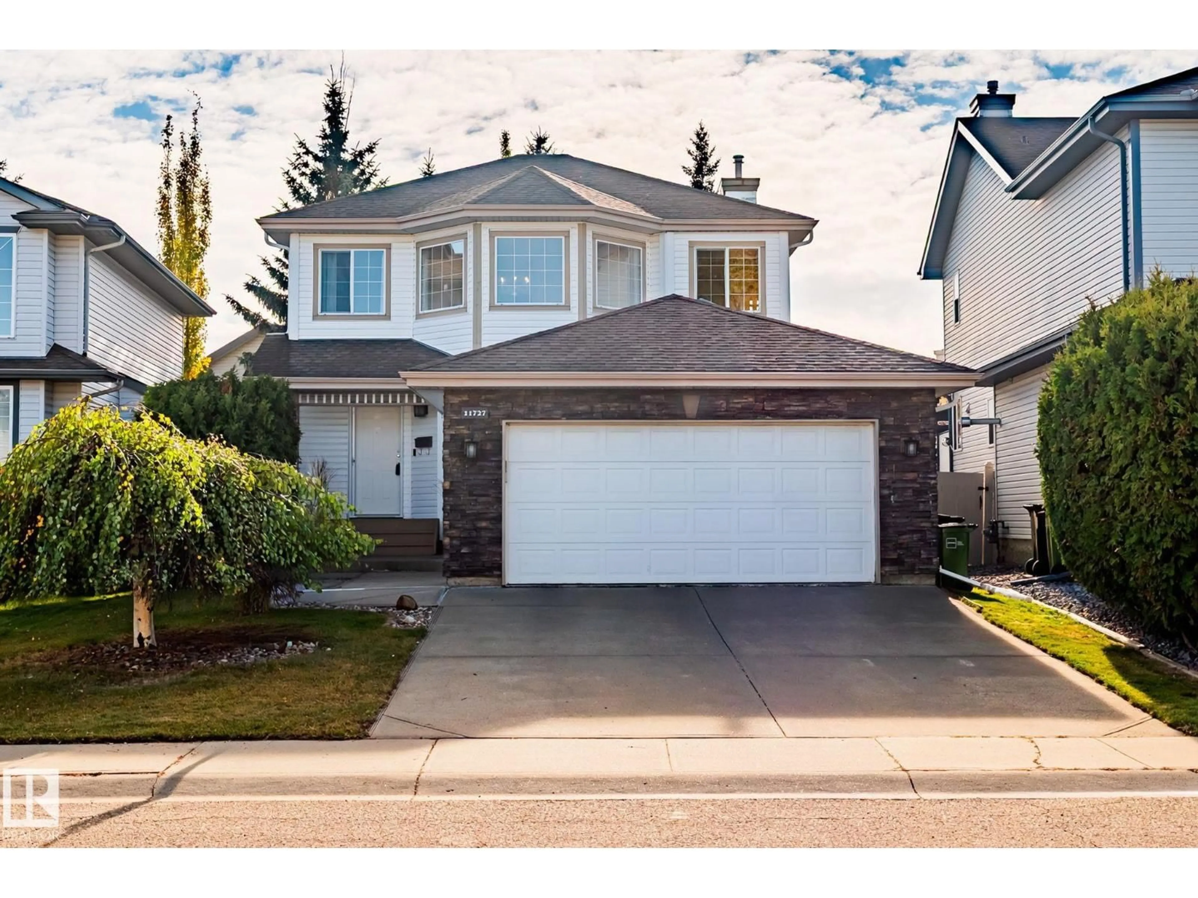 Home with vinyl exterior material, street for 11727 13 AV, Edmonton Alberta T6J7G1