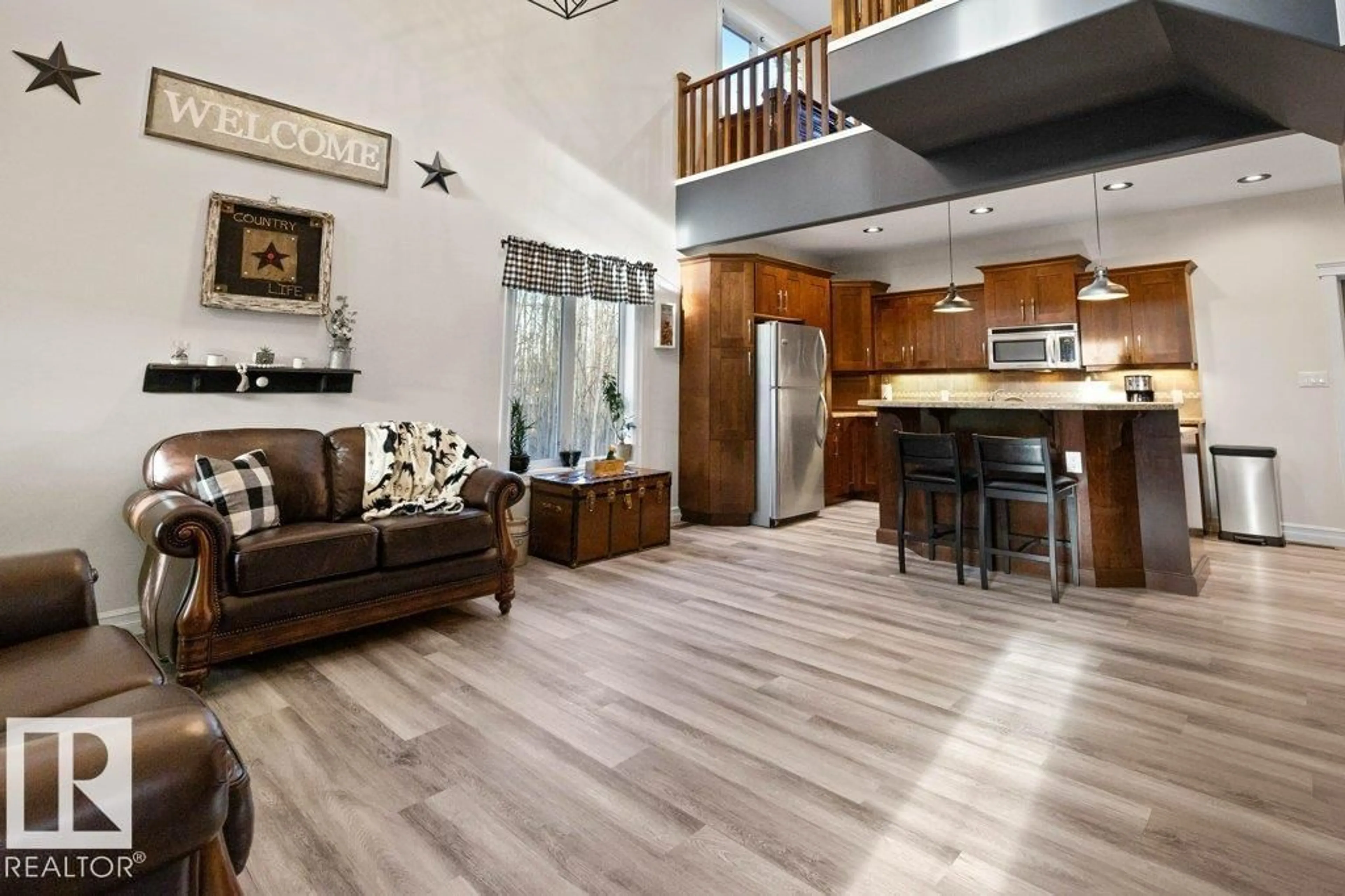 Open concept kitchen, wood/laminate floor for 144 462054 RGE ROAD 11, Rural Wetaskiwin County Alberta T0C2V0