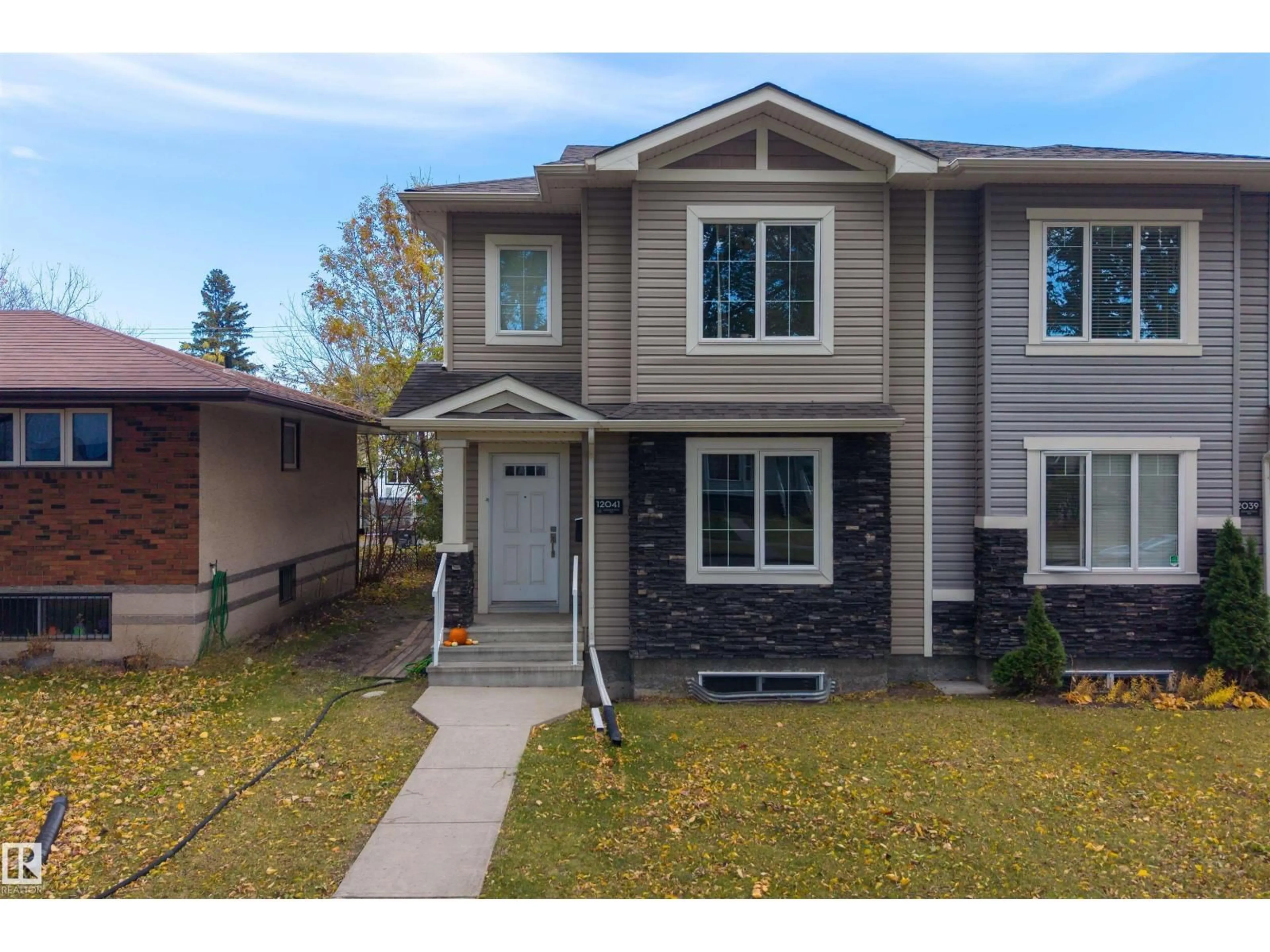 Home with vinyl exterior material, street for 12041 103 ST, Edmonton Alberta T5G2J7