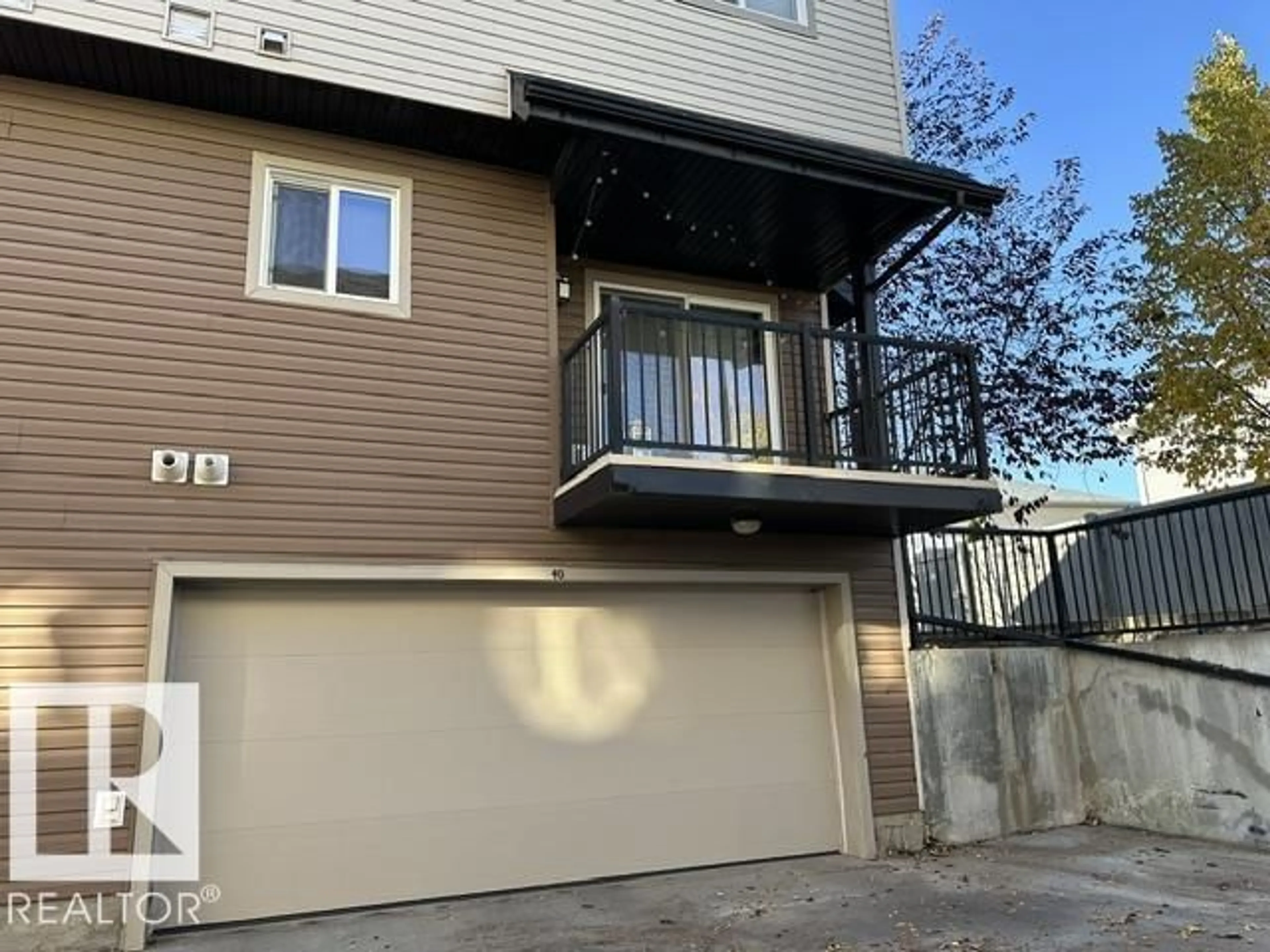 Home with vinyl exterior material, street for 40 - 8716 179 AV, Edmonton Alberta T5Z0J3