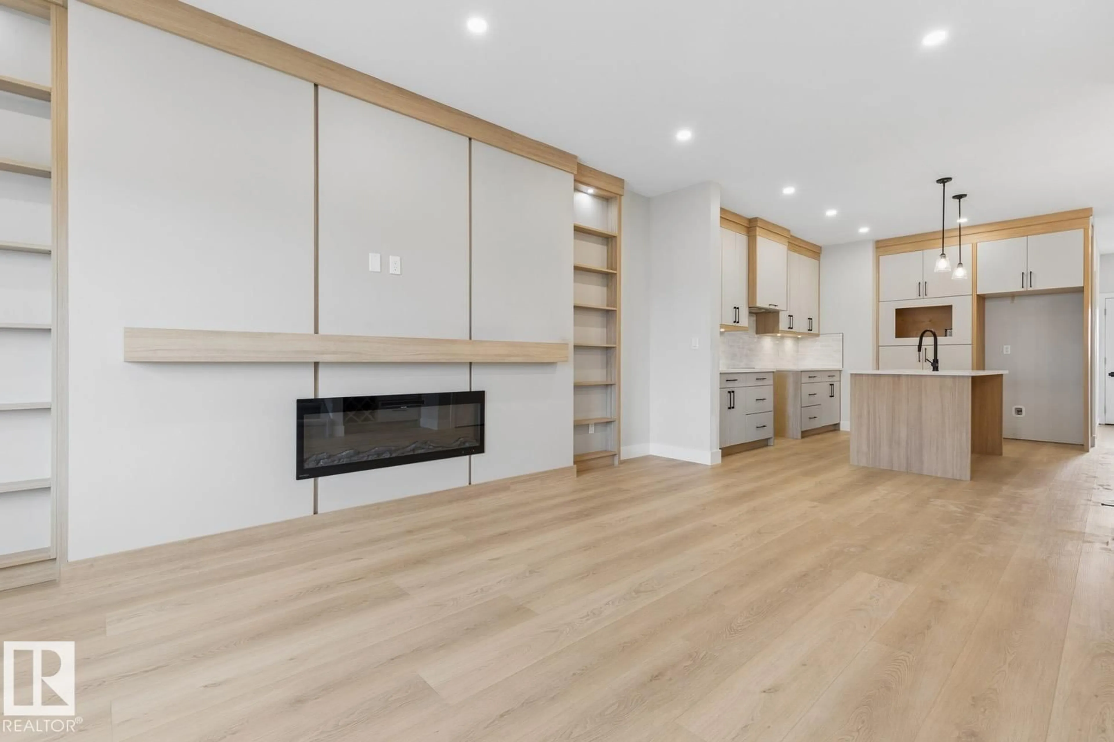 Open concept kitchen, wood/laminate floor for 496 ROBINSON BV, Leduc Alberta T9E1Z3
