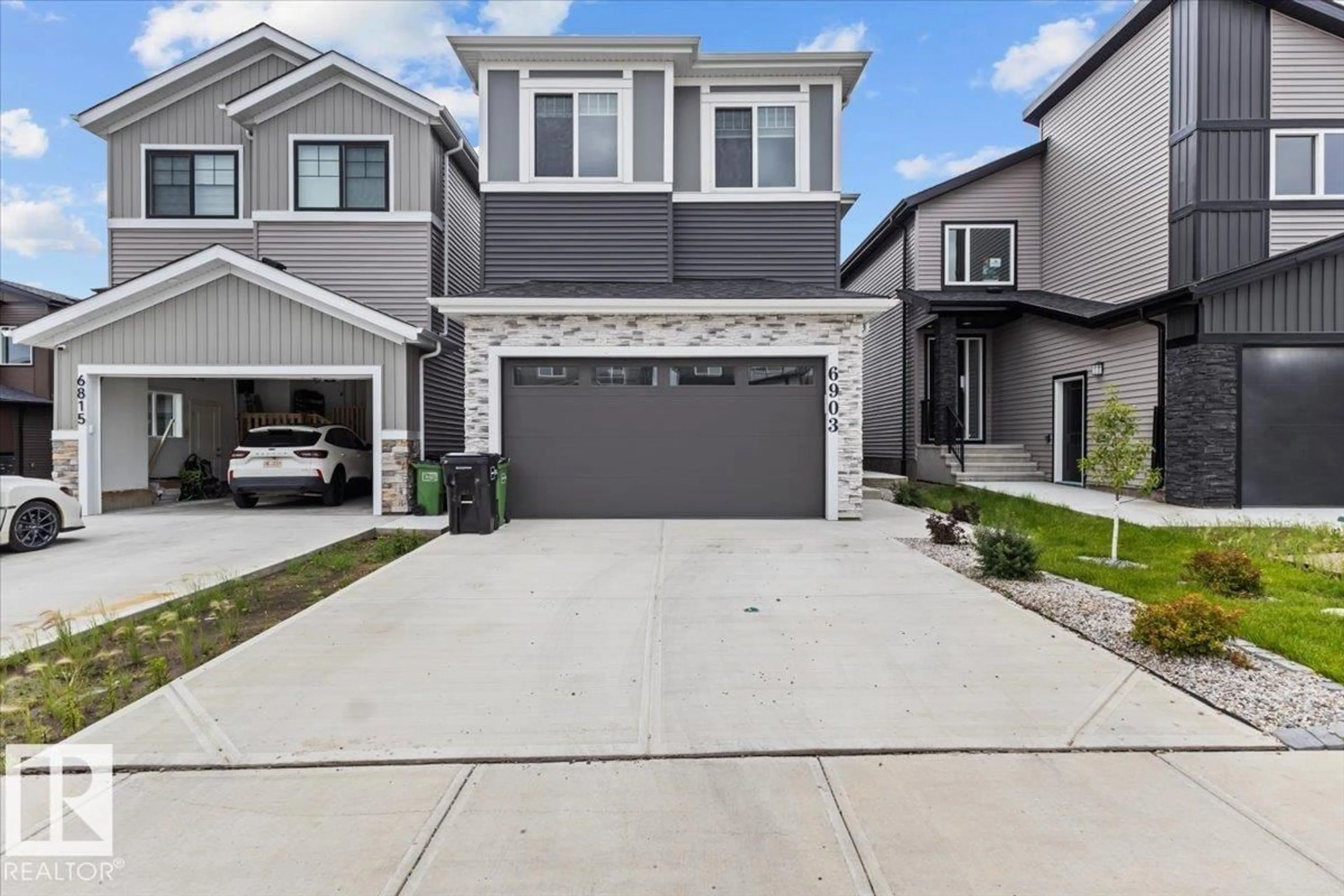 Home with vinyl exterior material, street for NW - 6903 169 AV, Edmonton Alberta T5Z0H2
