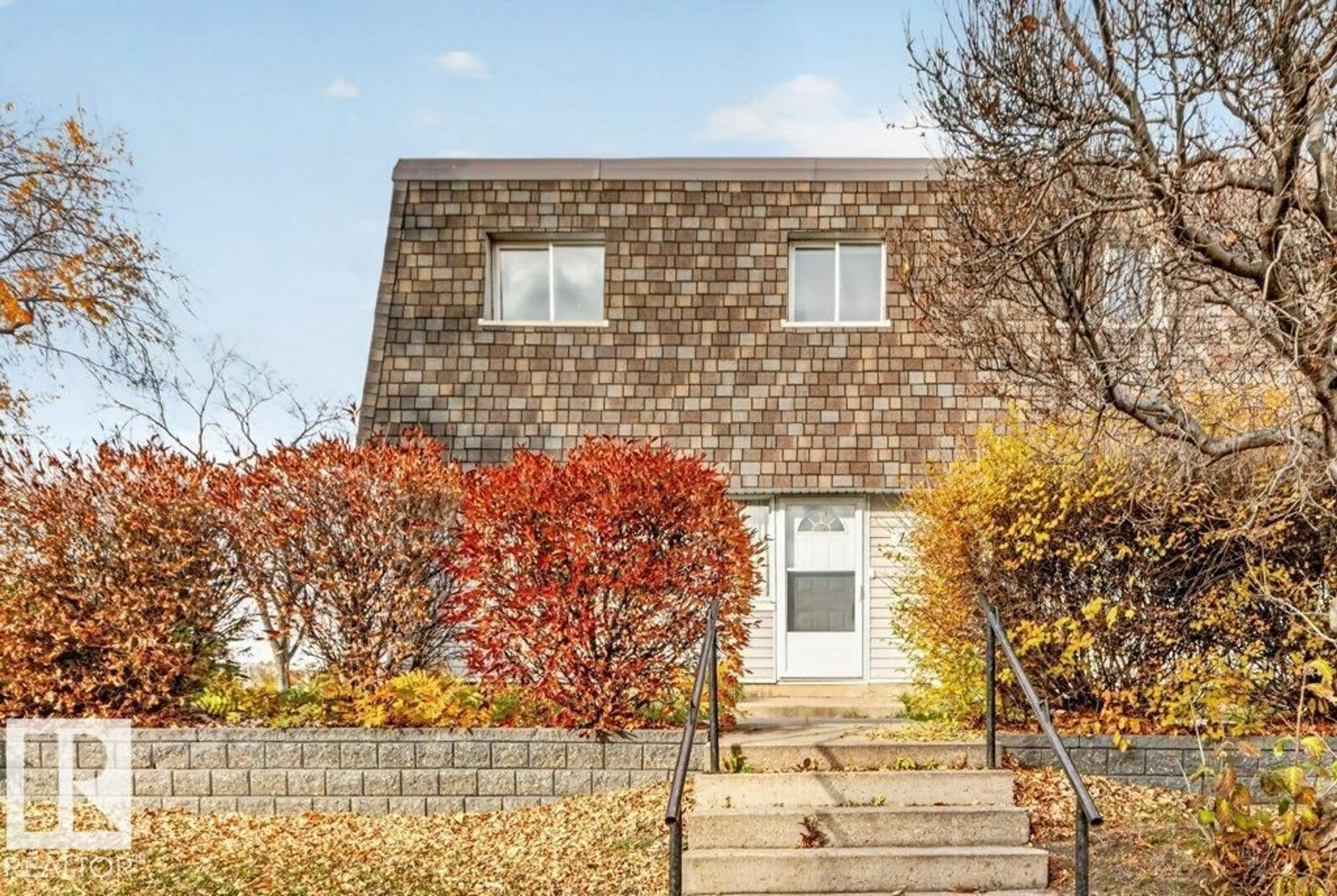 Home with brick exterior material, building for 123 VILLAGE ON THE GR NW, Edmonton Alberta T5A1H2