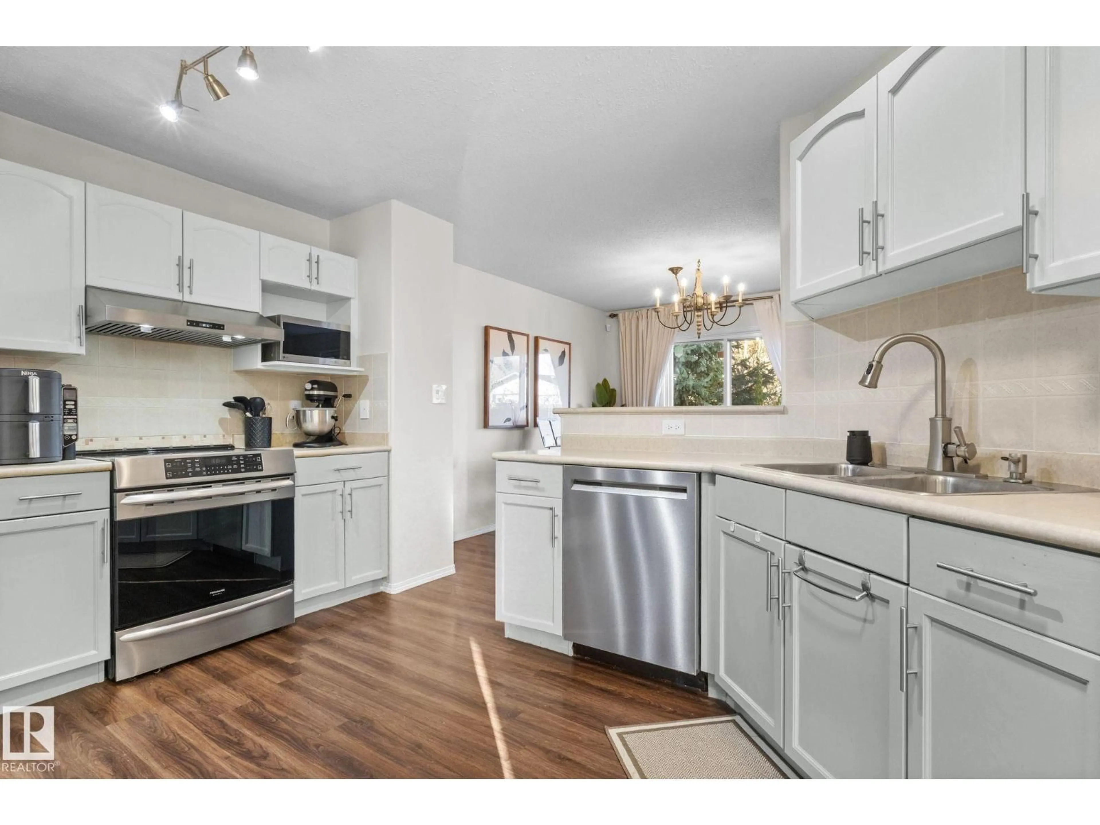 Open concept kitchen, unknown for 1912 35A AV, Edmonton Alberta T6T1Y9