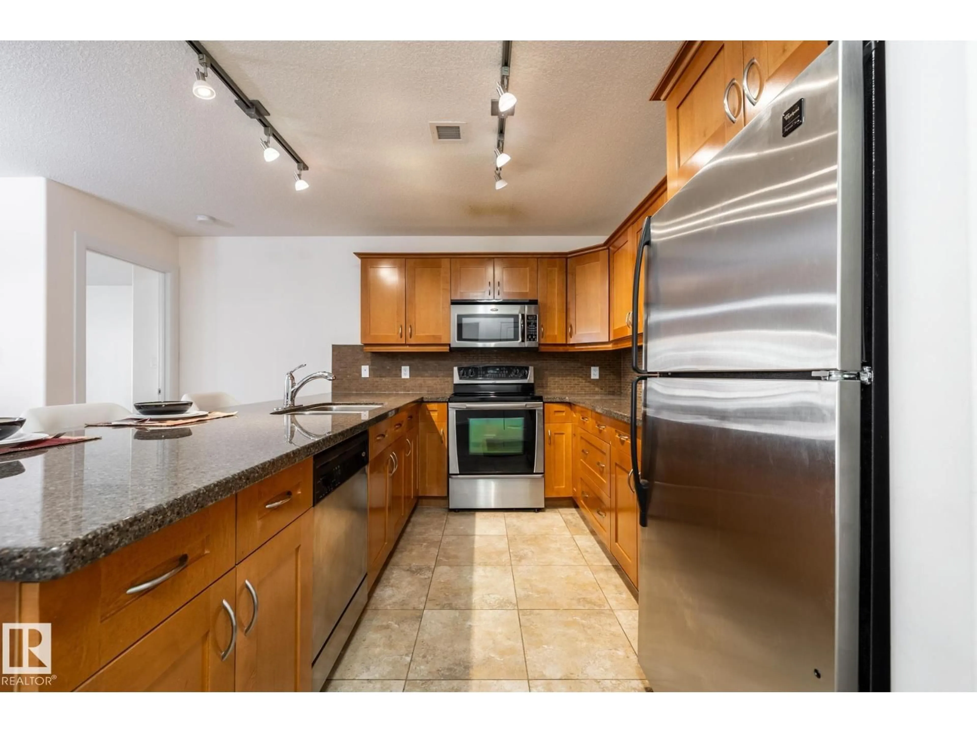 Open concept kitchen, ceramic/tile floor for 207 - 400 PALISADES WY, Sherwood Park Alberta T8H0H4