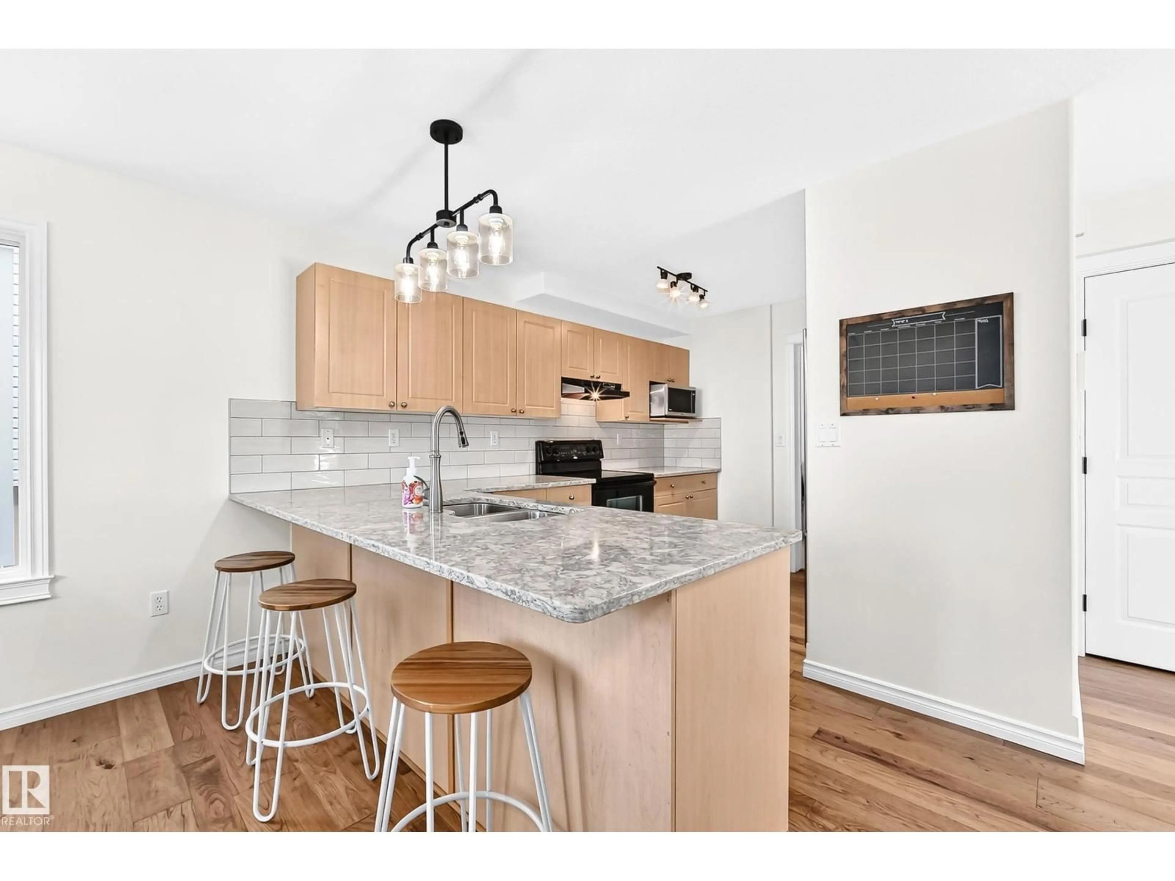 Open concept kitchen, wood/laminate floor for 86 EASTGATE WY, St. Albert Alberta T8N7K1