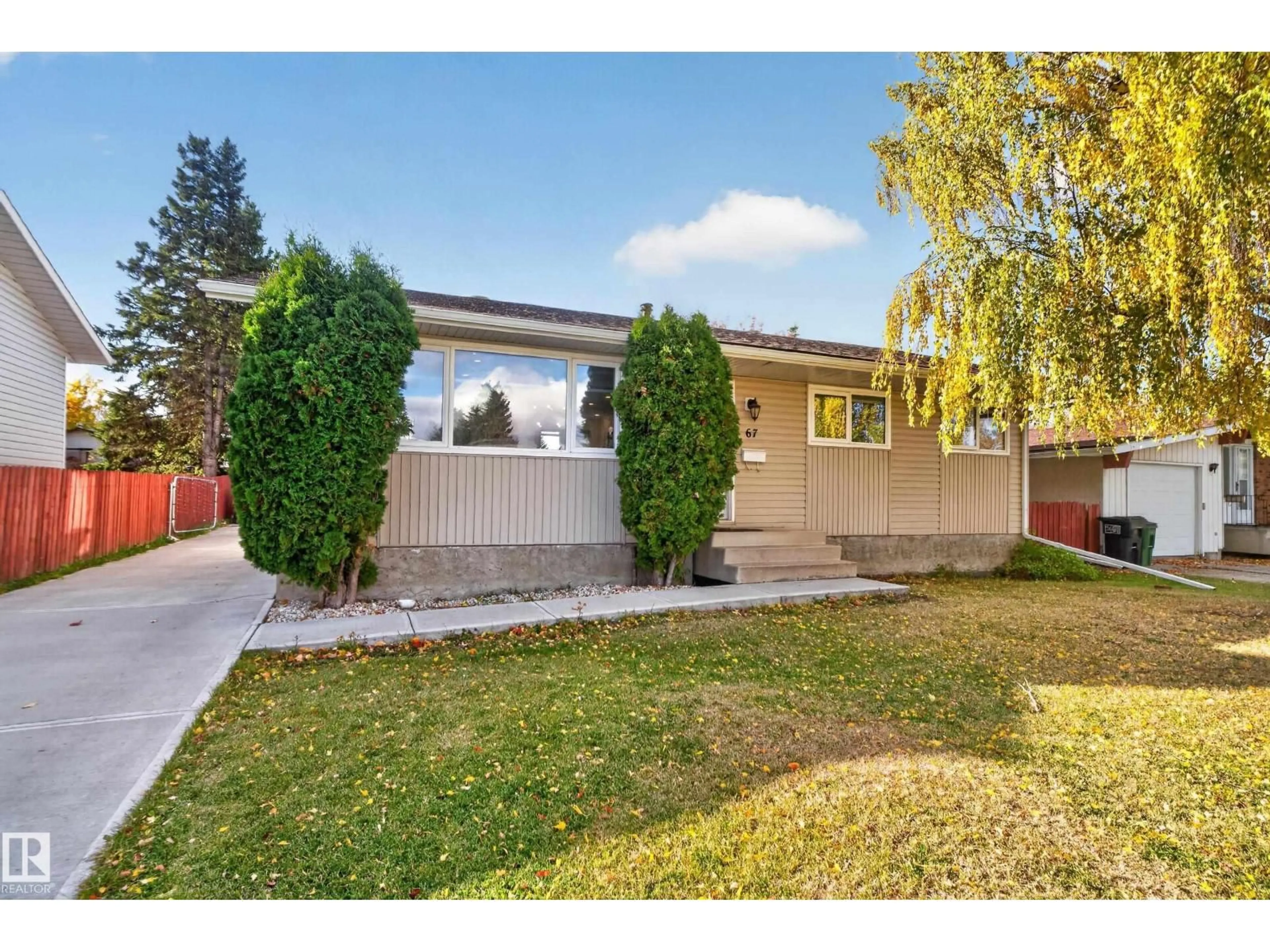 Home with vinyl exterior material, street for 67 HENRY AV, Edmonton Alberta T5A2X6
