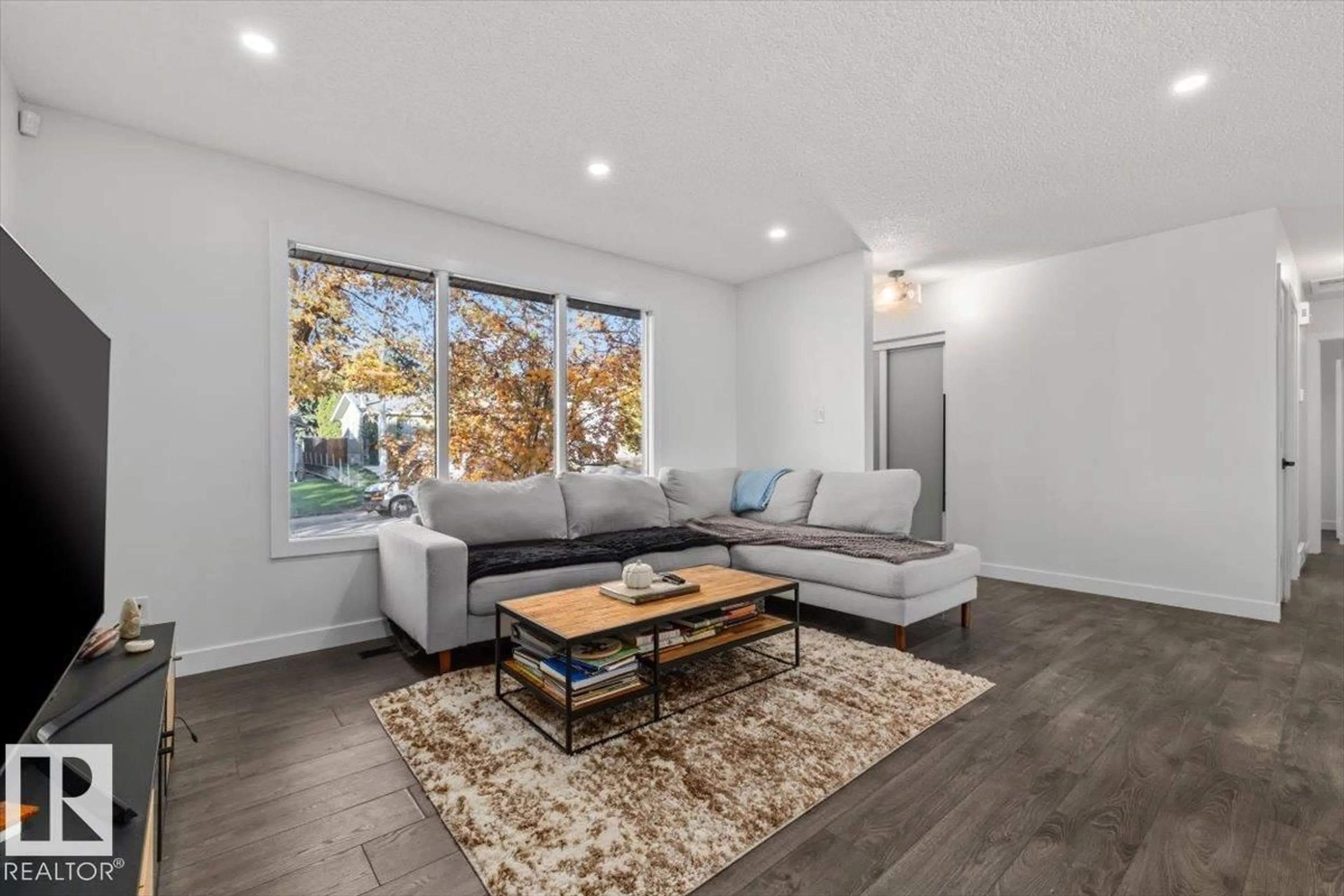 Living room with furniture, wood/laminate floor for 42 GLENGARRY CR, Sherwood Park Alberta T8A3A2