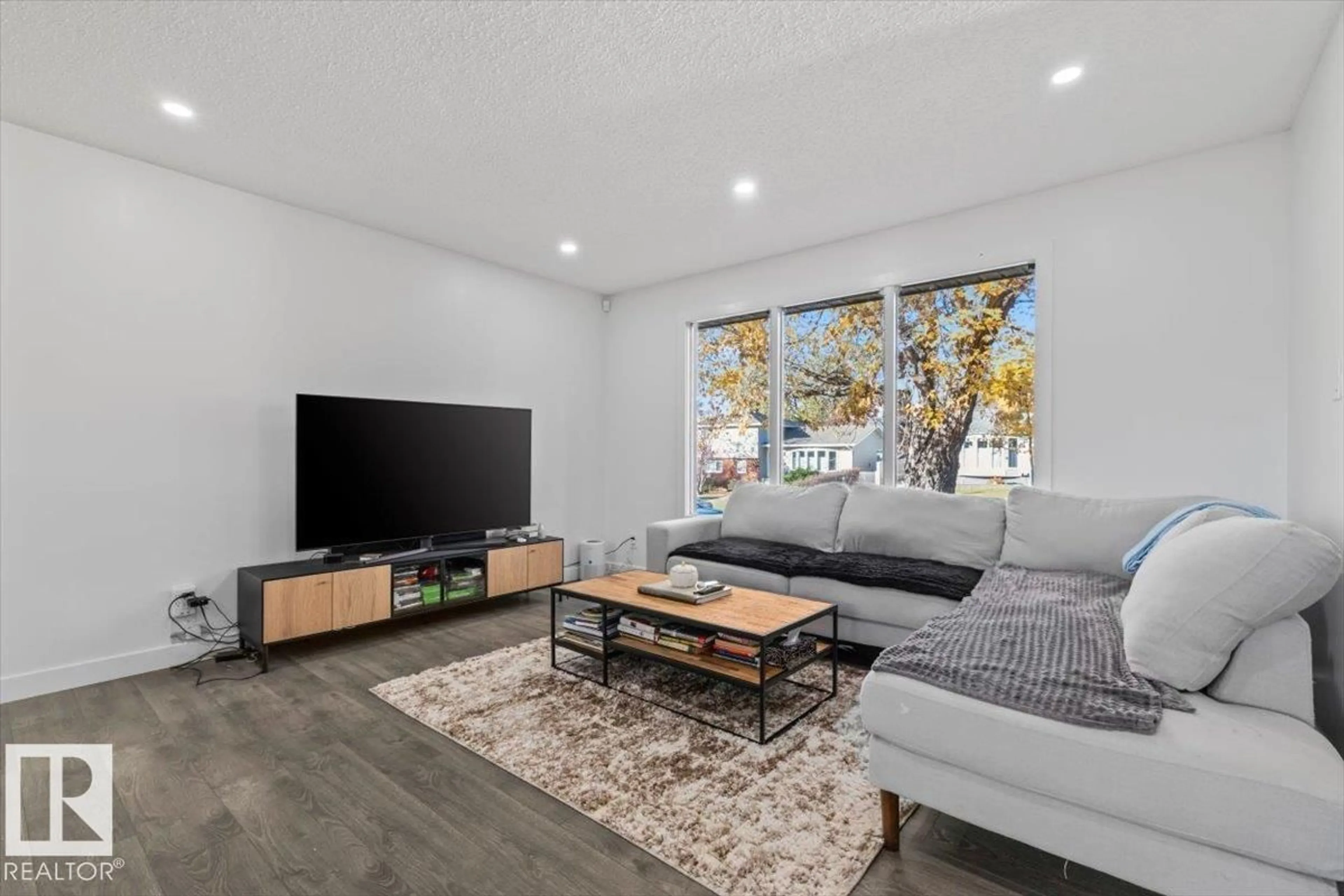 Living room with furniture, wood/laminate floor for 42 GLENGARRY CR, Sherwood Park Alberta T8A3A2