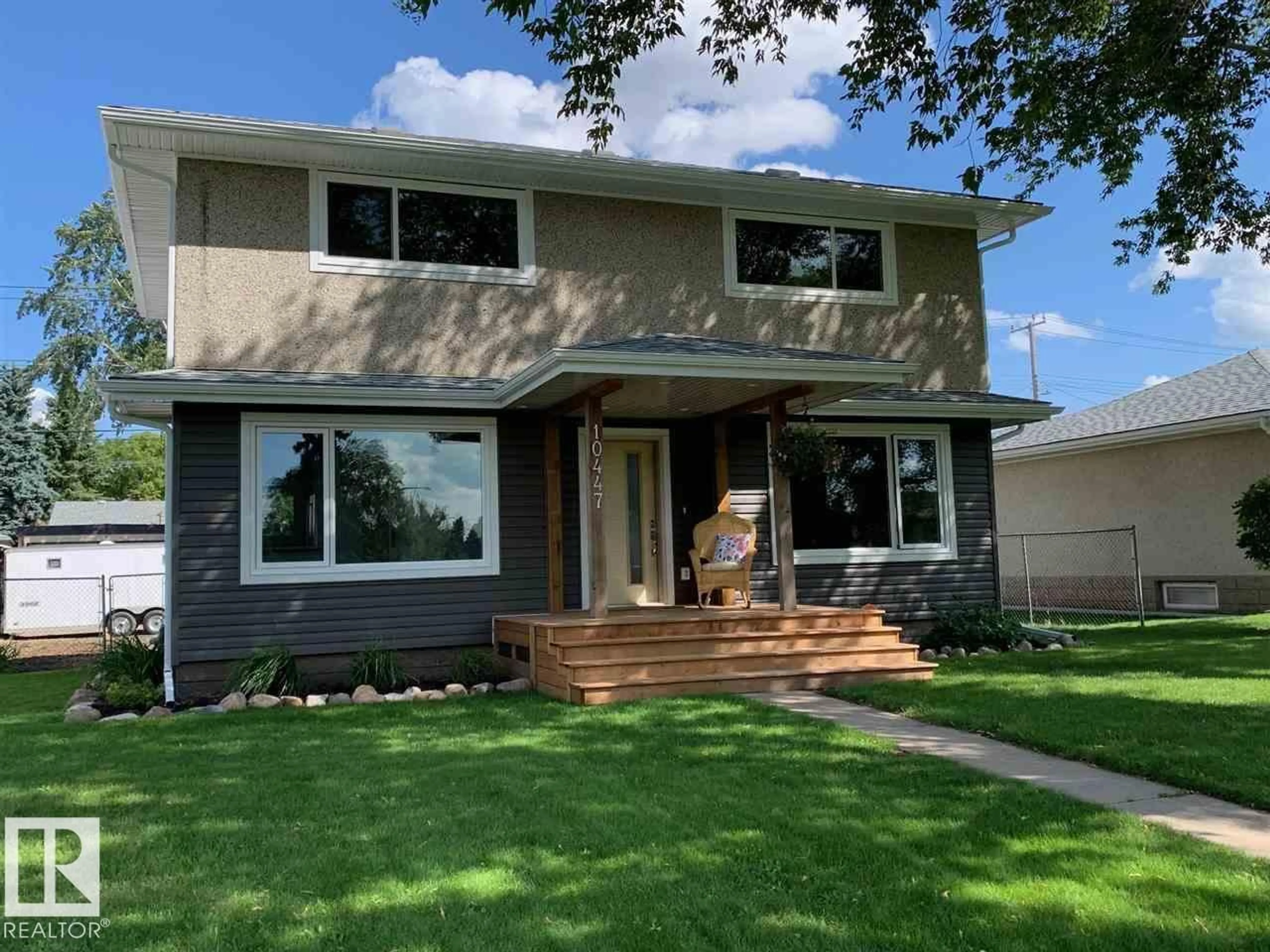 Home with vinyl exterior material, street for 10447 52 ST NW, Edmonton Alberta T6A2G9