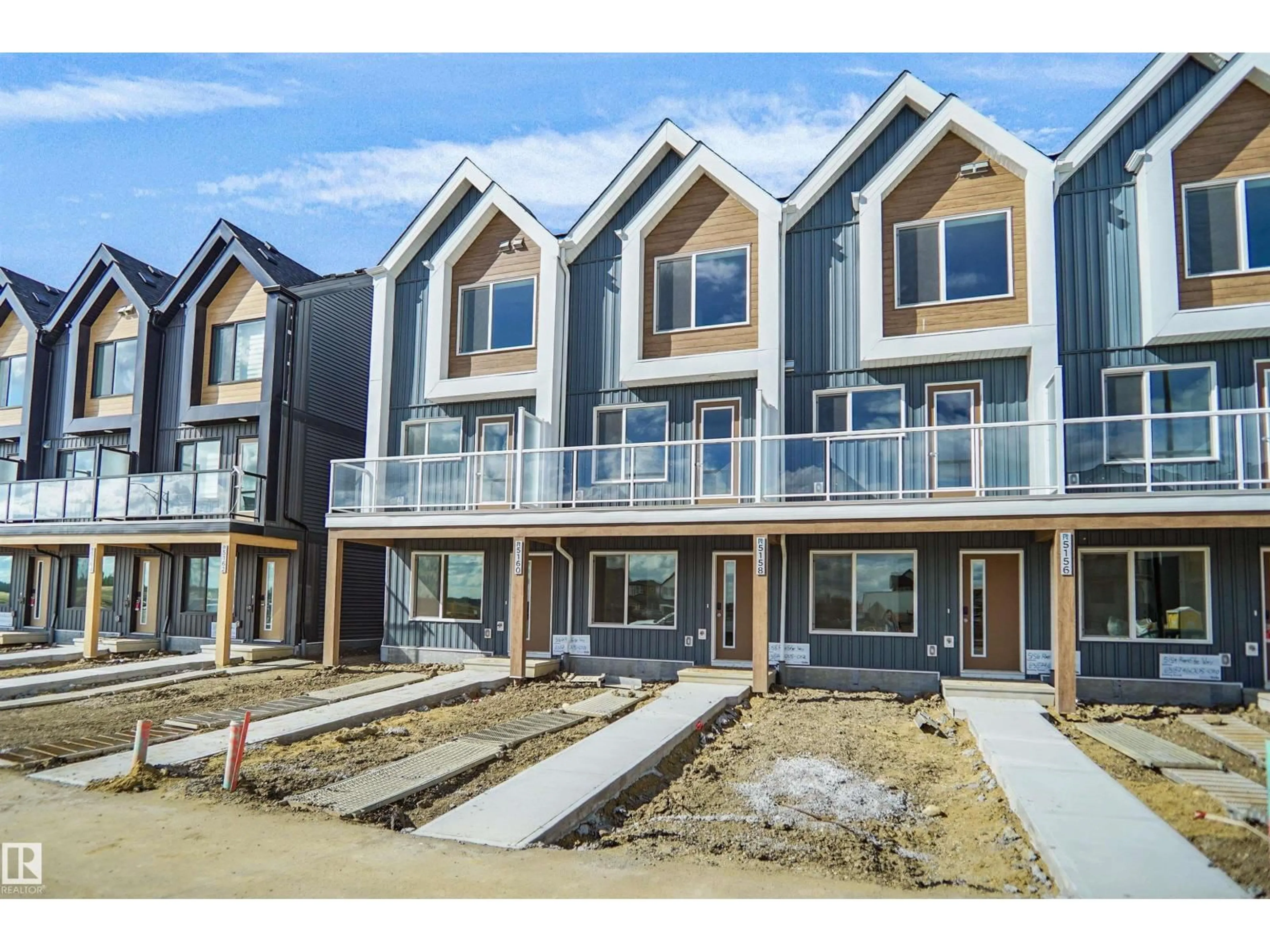 Home with vinyl exterior material, street for 5174 RIVER'S EDGE WY, Edmonton Alberta T6M3B5