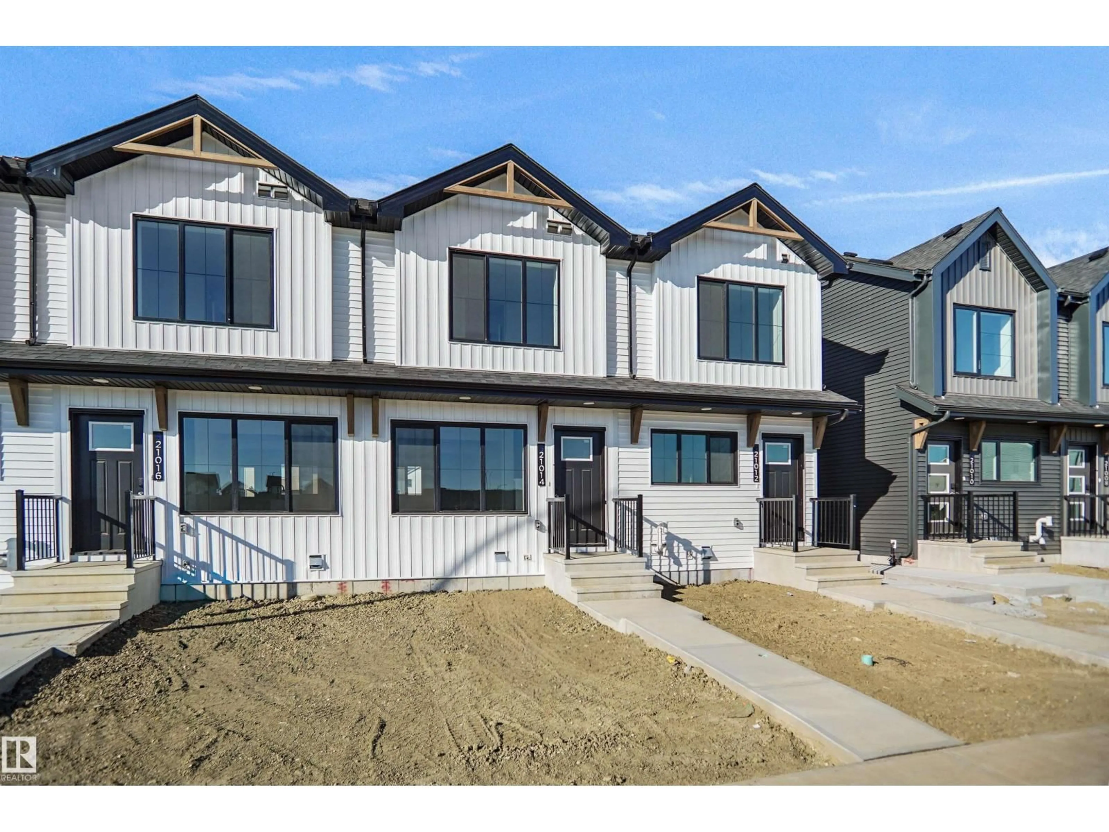 Home with vinyl exterior material, street for NW - 21006 24 AV, Edmonton Alberta T6M2M7