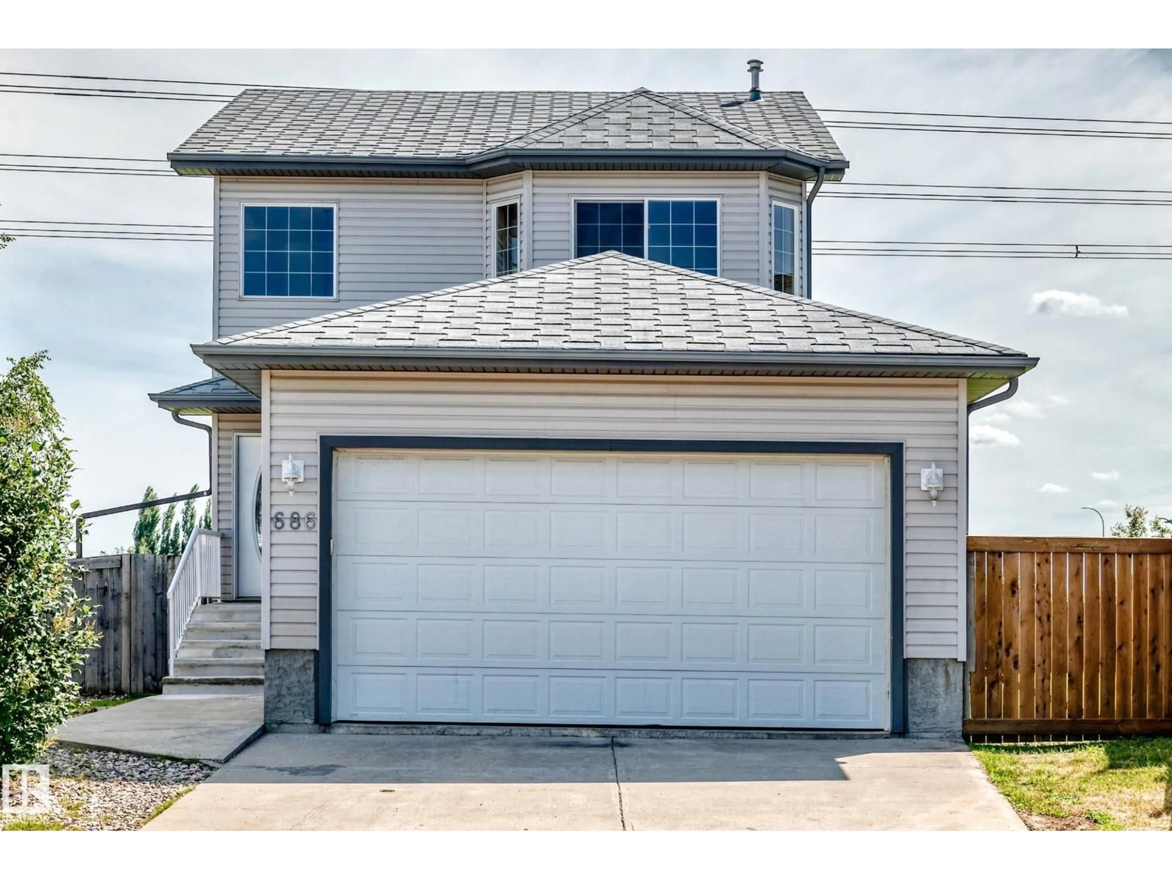 Home with vinyl exterior material, street for 686 KANANASKIS DR, Devon Alberta T9G2G8