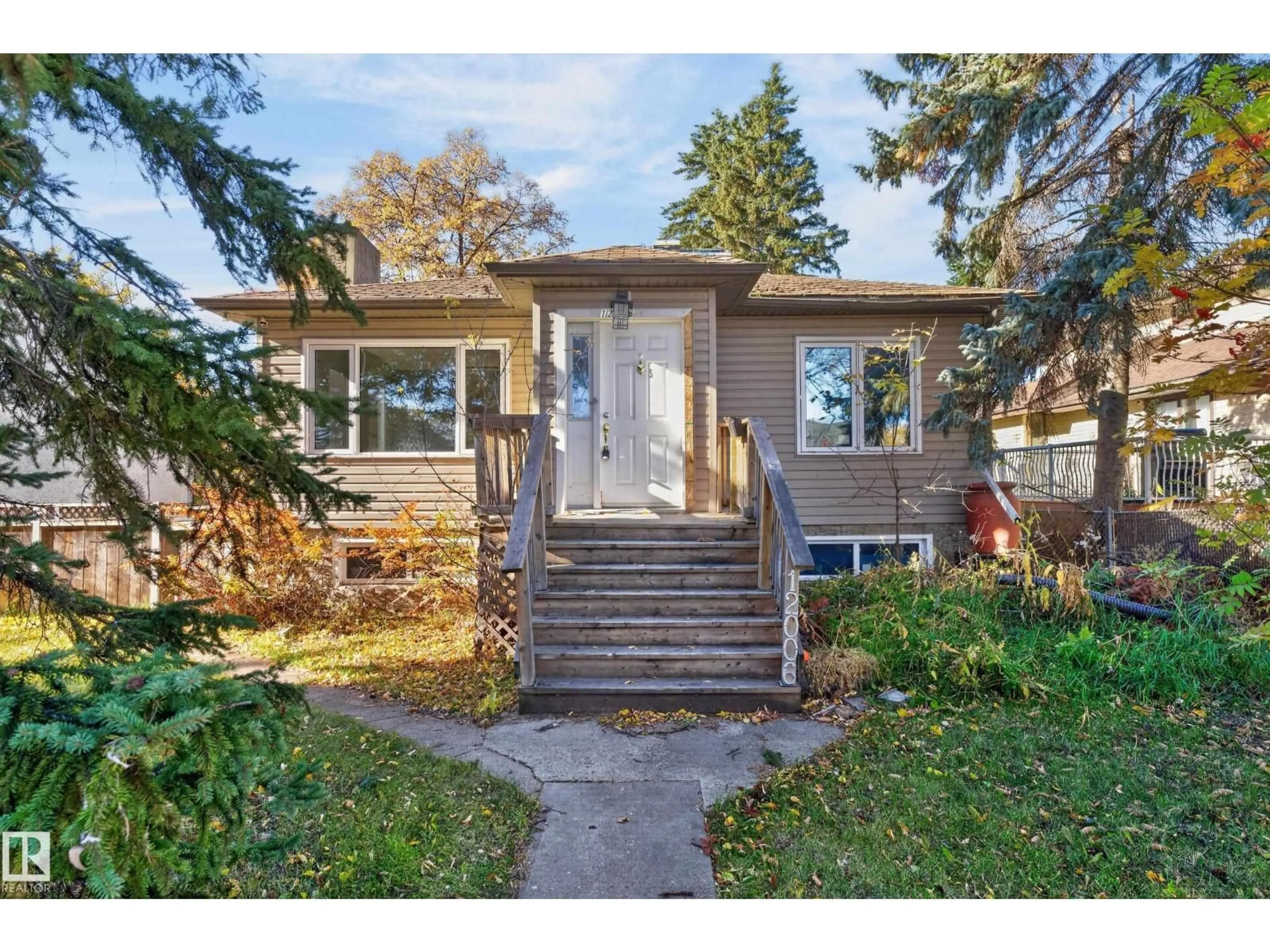 Home with vinyl exterior material, street for 12006 104 ST, Edmonton Alberta T5G2L4