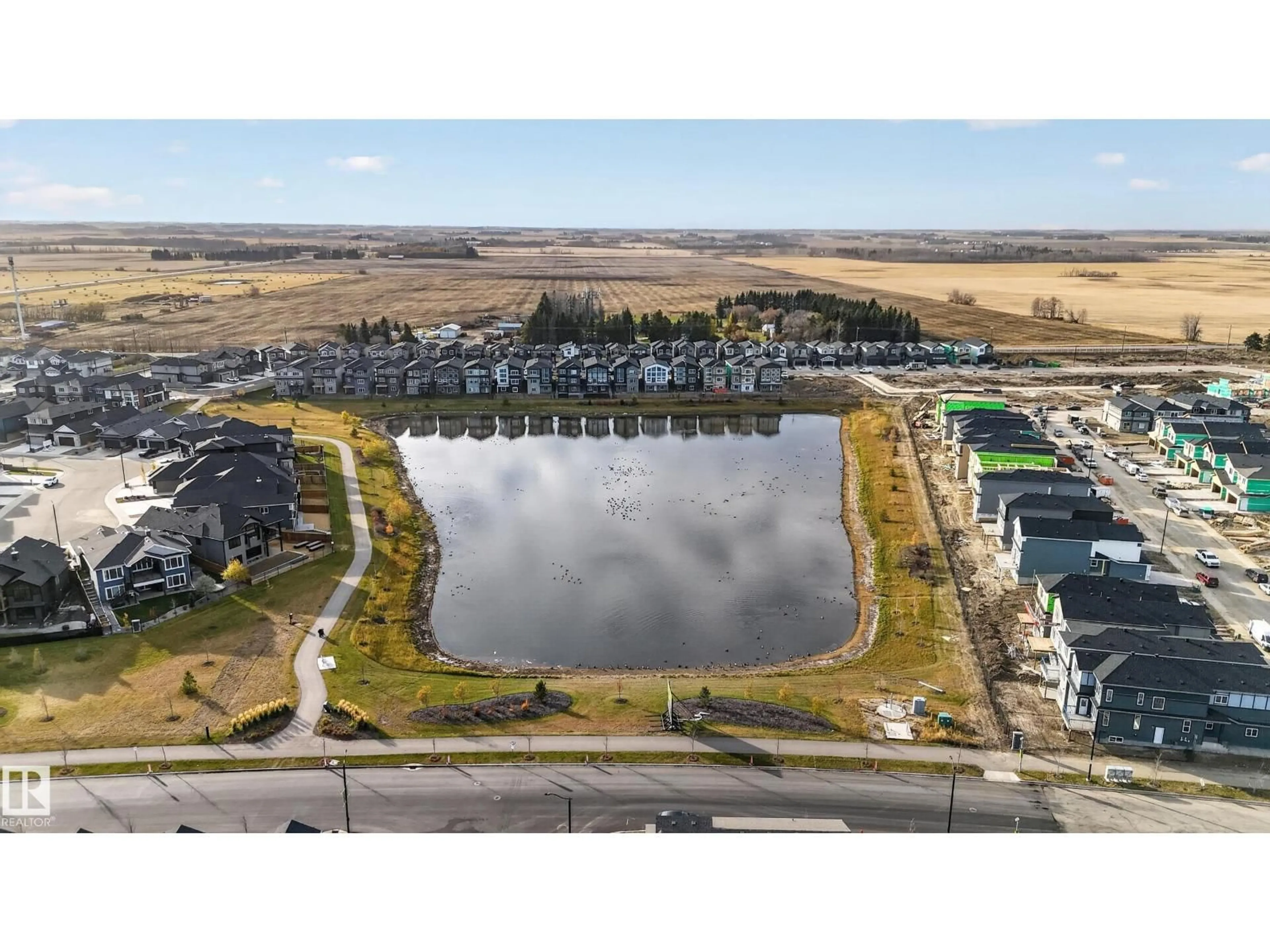 A pic from outside/outdoor area/front of a property/back of a property/a pic from drone, water/lake/river/ocean view for NE - 386 LINDEN LO, Leduc Alberta T9E1T2