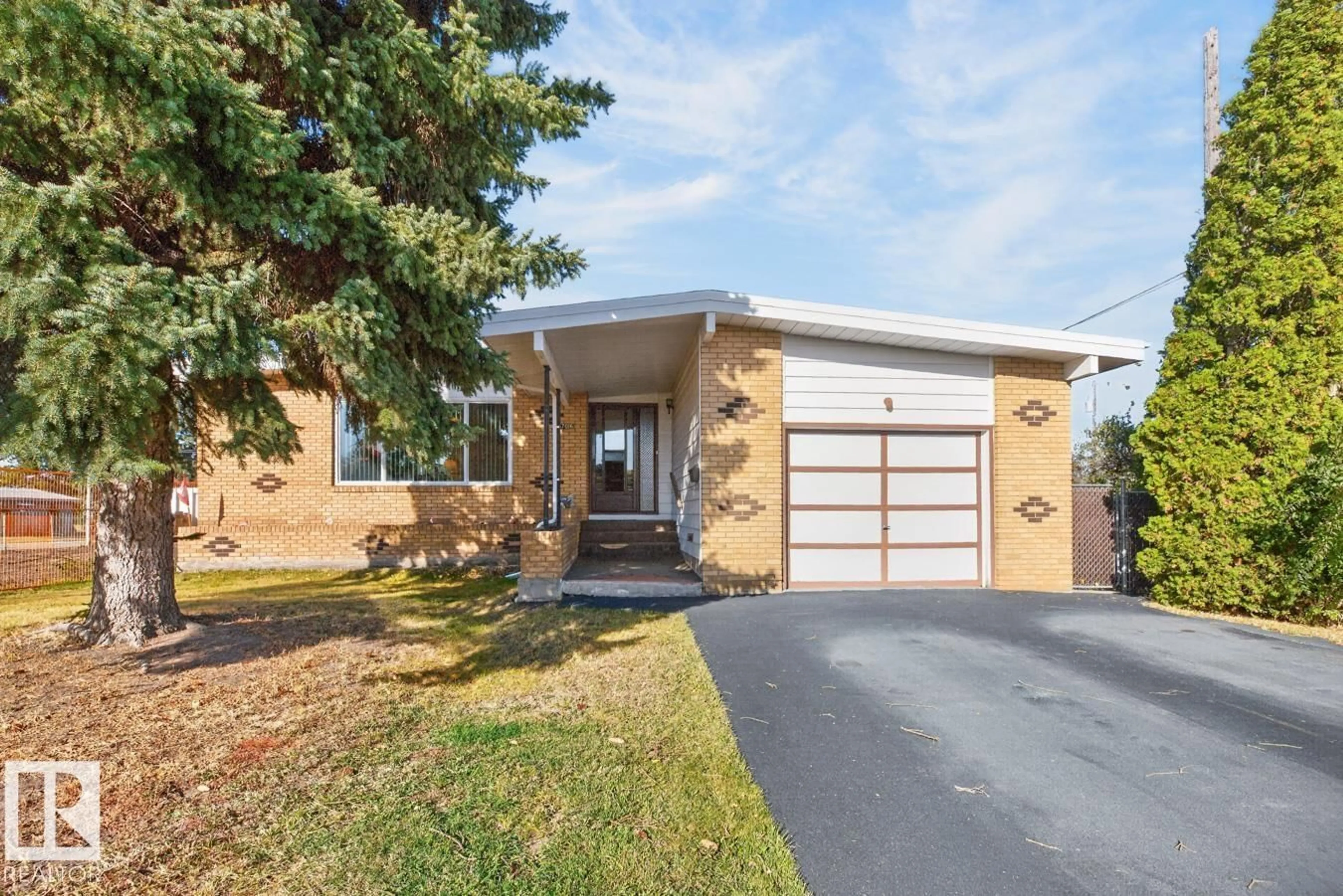 Home with brick exterior material, street for NW - 7016 86 AV, Edmonton Alberta T6B0K2