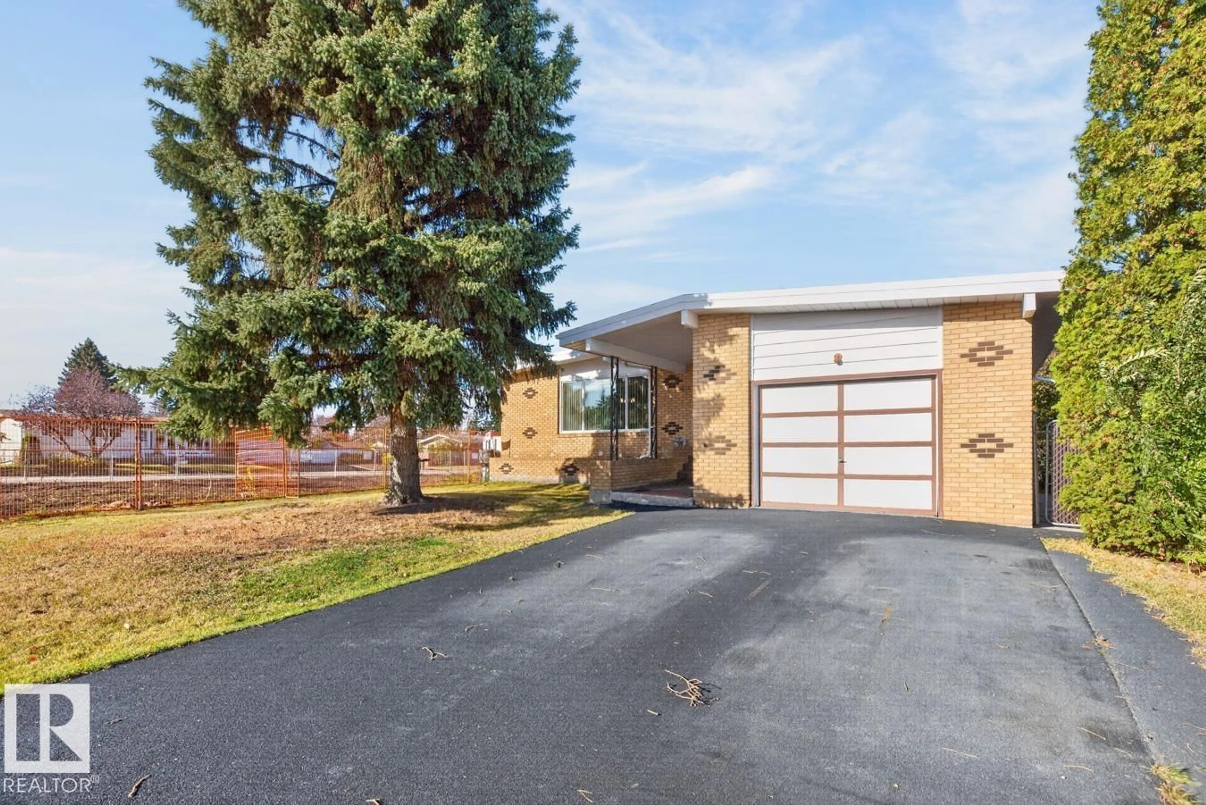 Home with brick exterior material, street for NW - 7016 86 AV, Edmonton Alberta T6B0K2