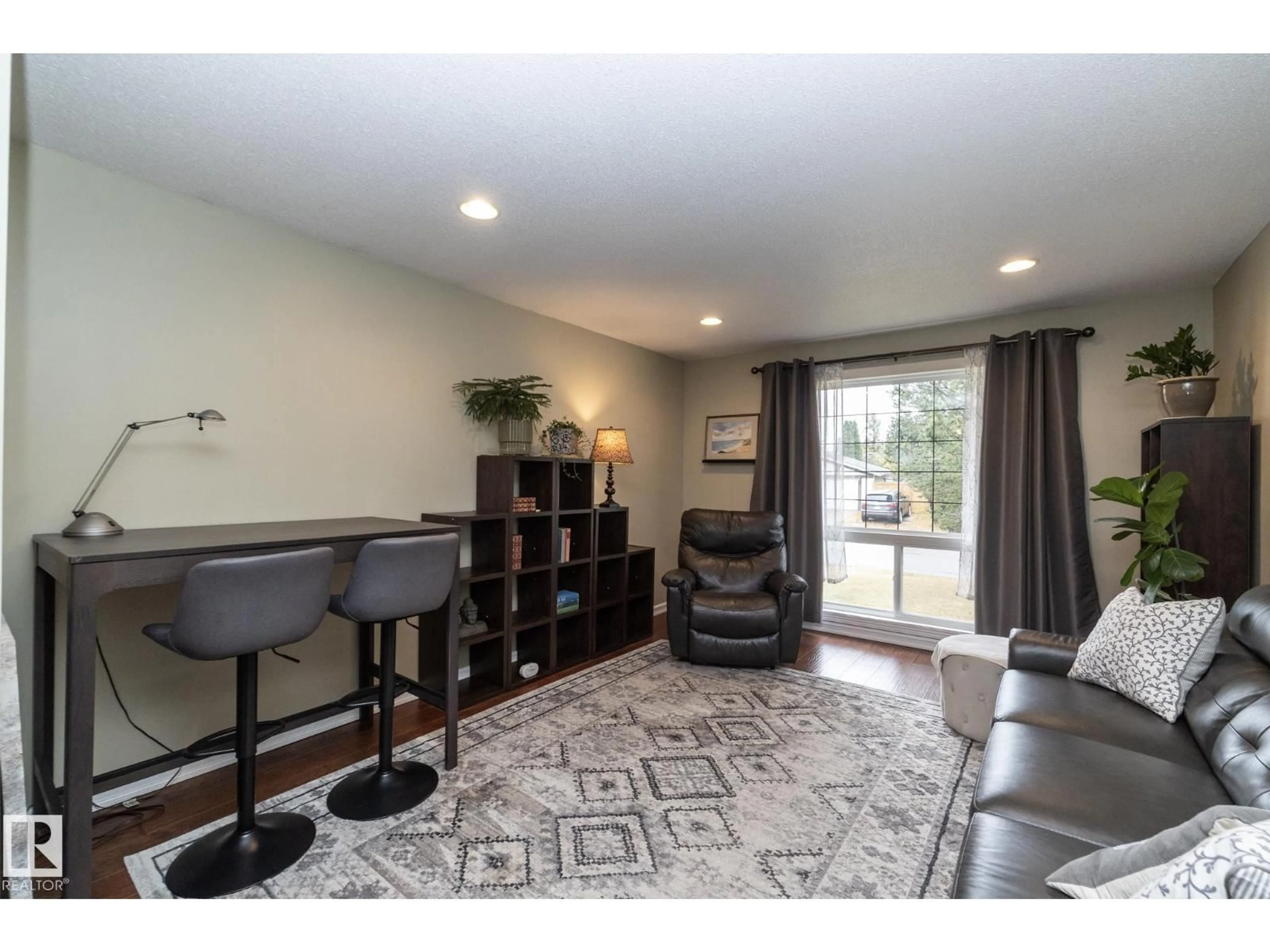Living room with furniture, unknown for 7412 33 AV, Edmonton Alberta T6K1J4