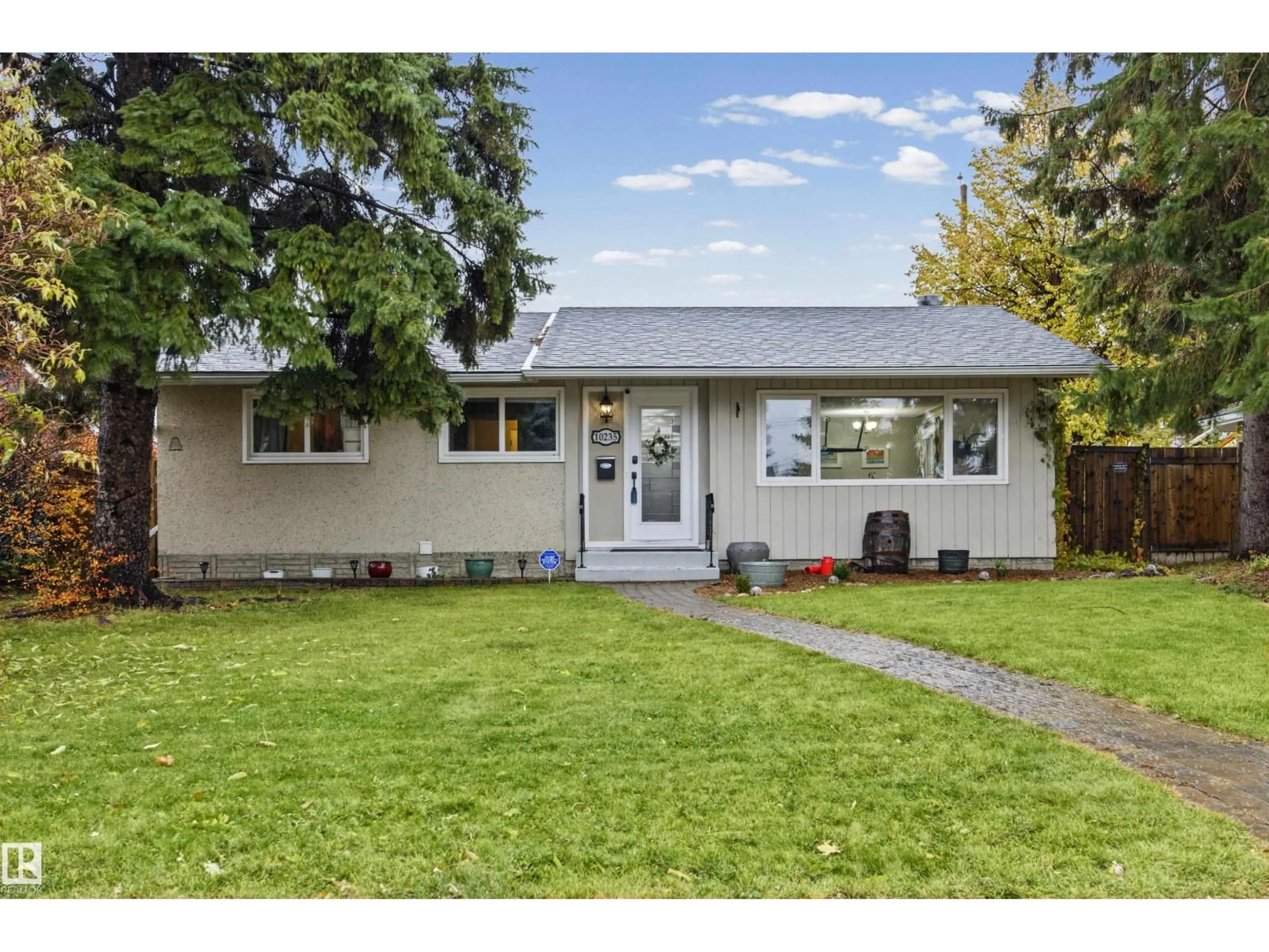 Home with vinyl exterior material, street for 10235 FULTON RD, Edmonton Alberta T6A3T5