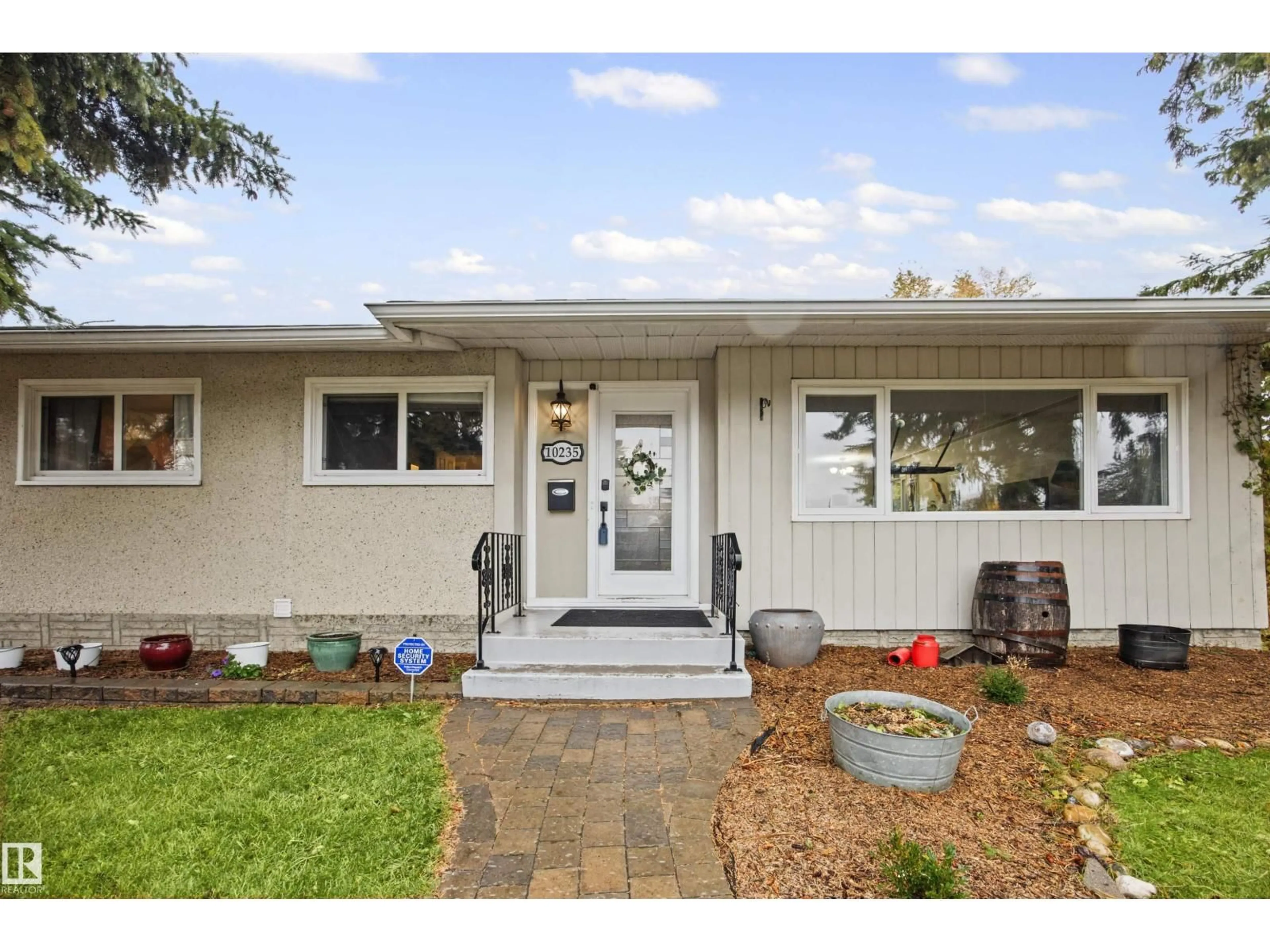 Home with vinyl exterior material, street for 10235 FULTON RD, Edmonton Alberta T6A3T5