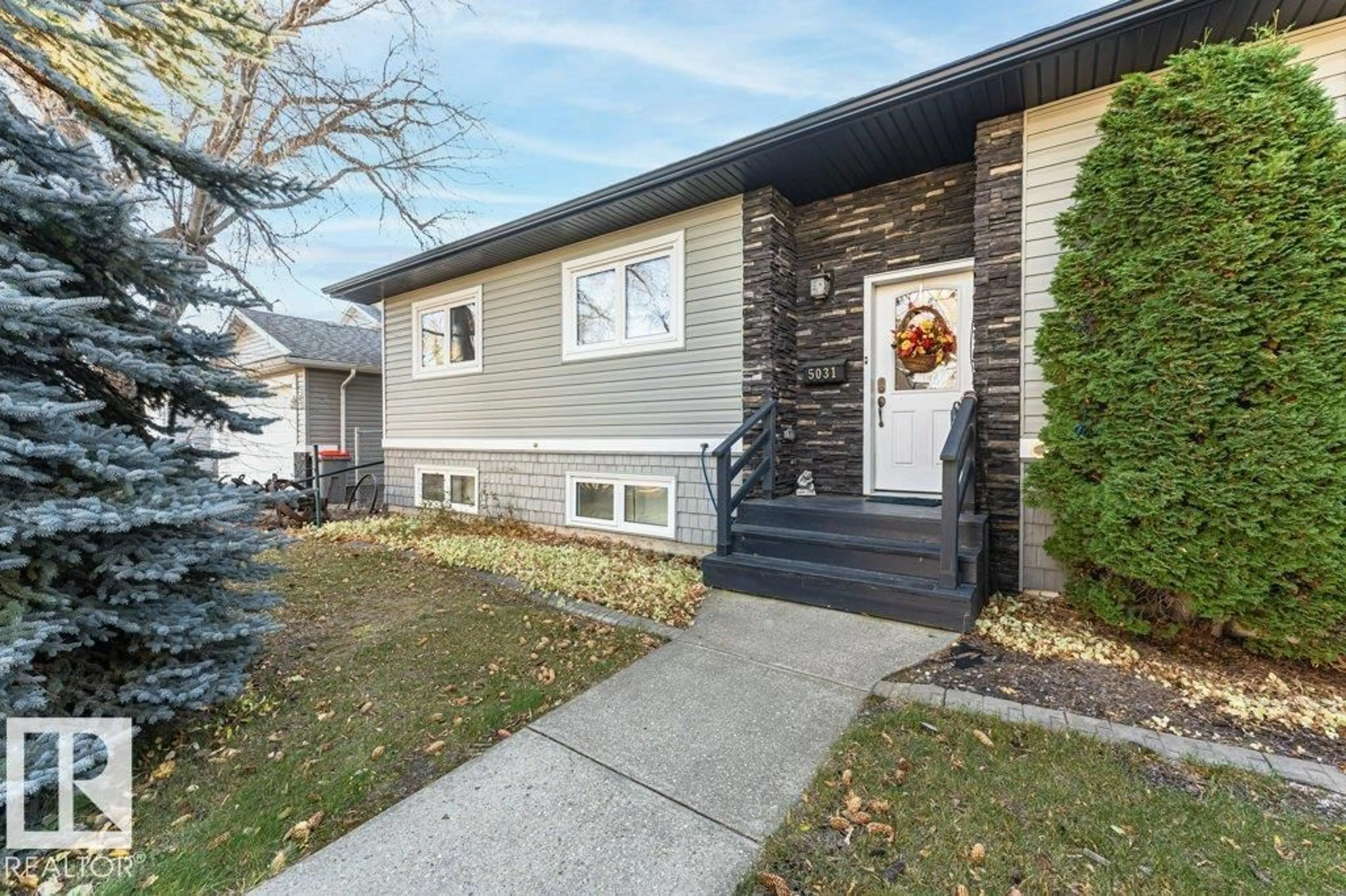 Home with vinyl exterior material, street for 5031 47, Millet Alberta T0C1Z0
