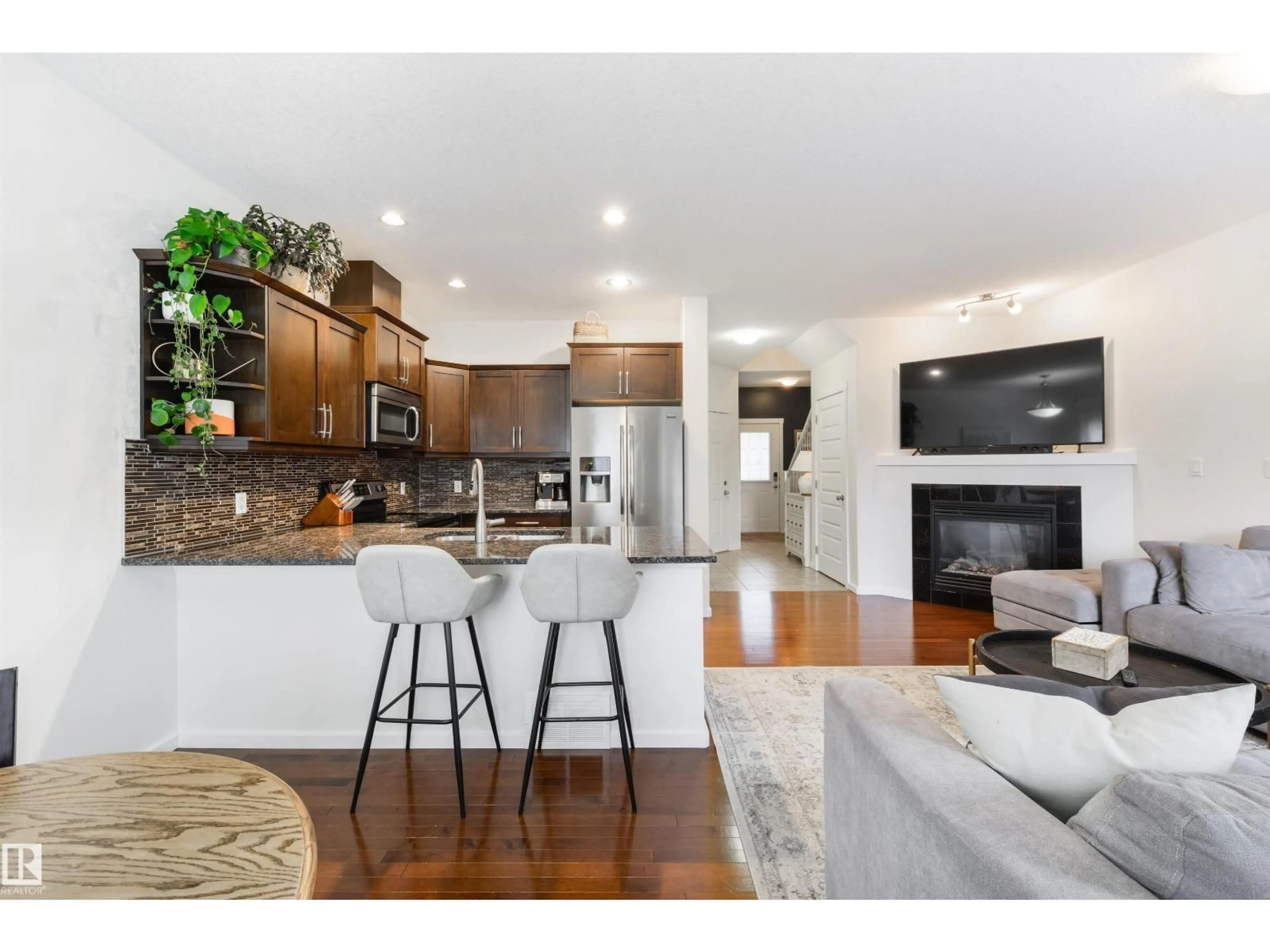 Open concept kitchen, wood/laminate floor for #3 - 16004 54 ST, Edmonton Alberta T5Y0R1
