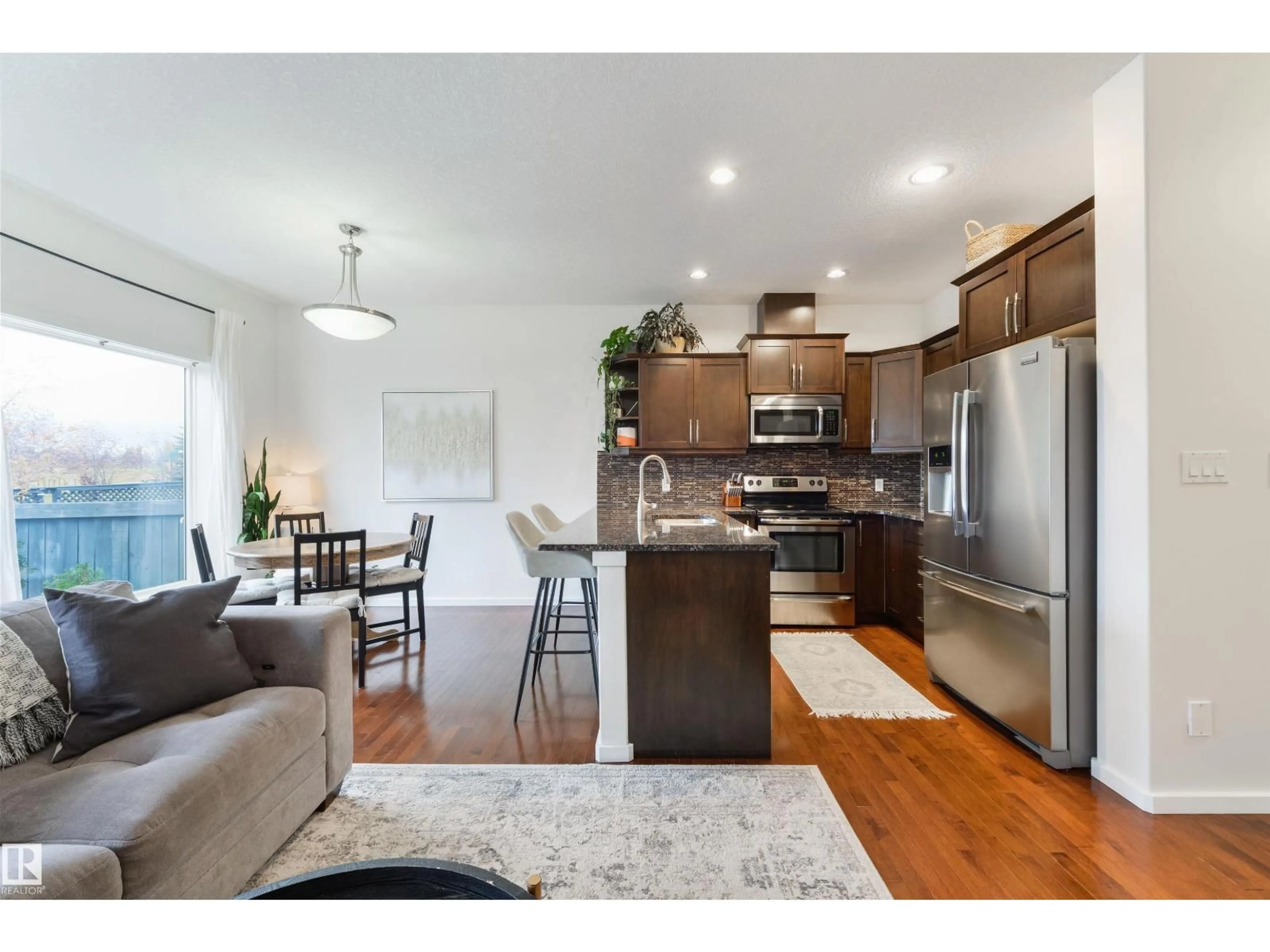 Open concept kitchen, wood/laminate floor for #3 - 16004 54 ST, Edmonton Alberta T5Y0R1
