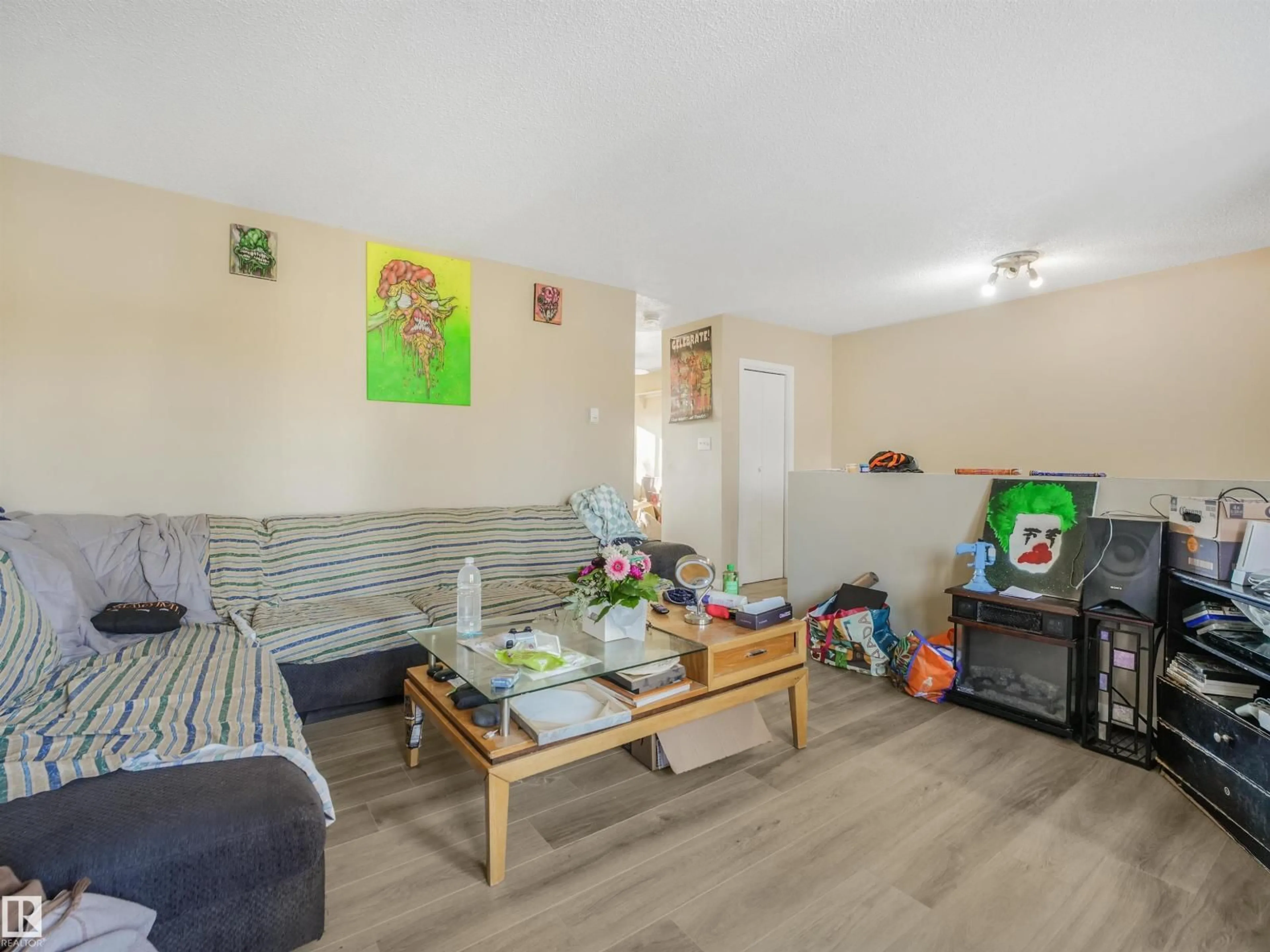Living room with furniture, wood/laminate floor for 4613 53 AV, Wetaskiwin Alberta T9A0Y5