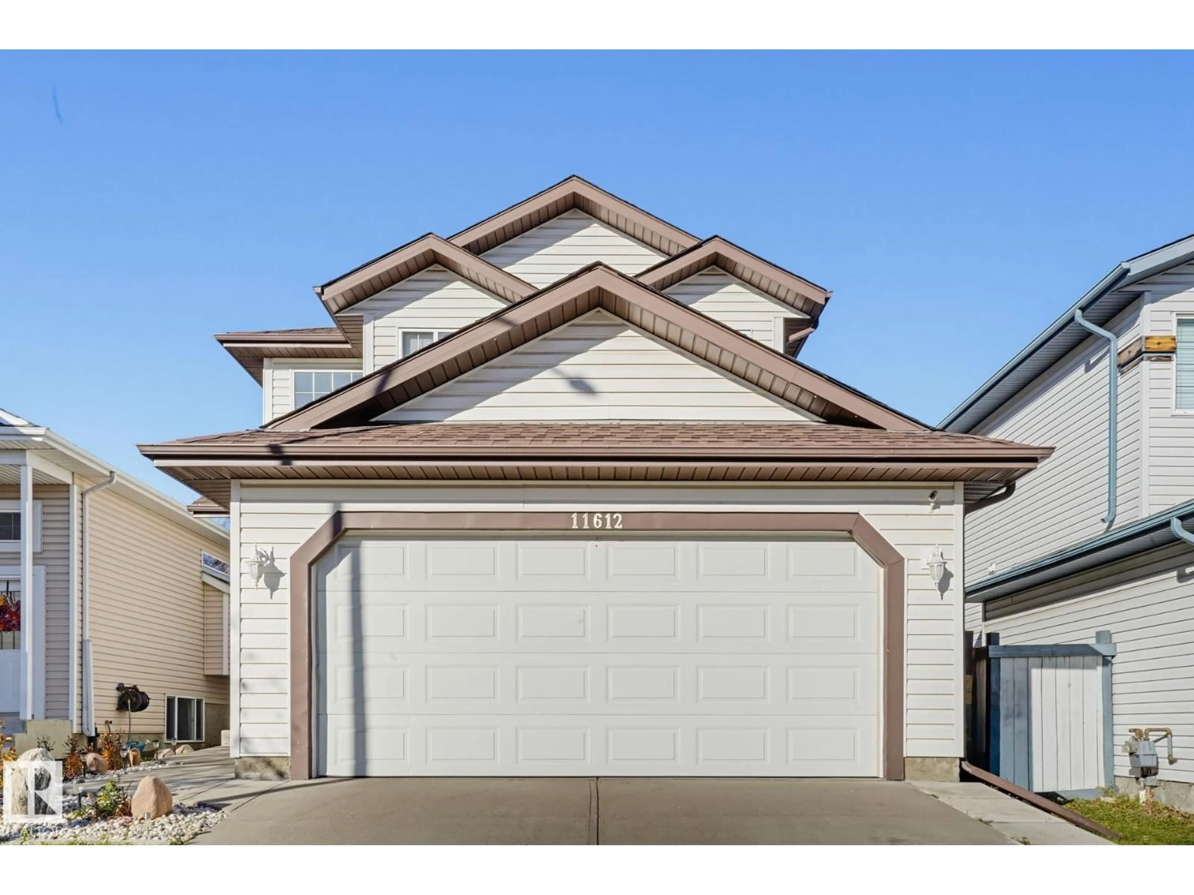 Home with vinyl exterior material, street for 11612 168 AV, Edmonton Alberta T5X6B7